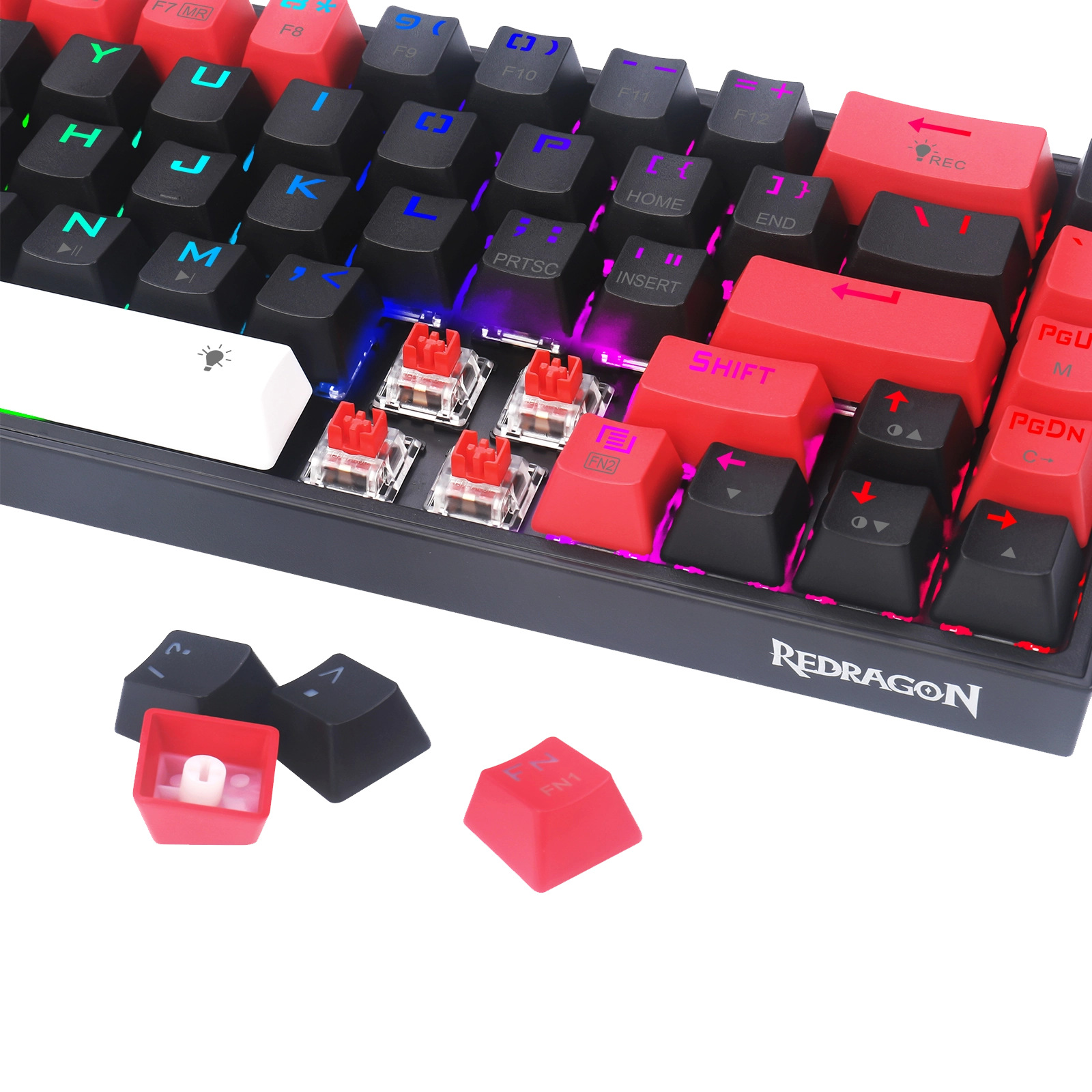 Klawiatura mechaniczna z czarnymi i czerwonymi klawiszami. Niektóre klawisze są usunięte, odsłaniając przełączniki. Widoczne jest logo Redragon.