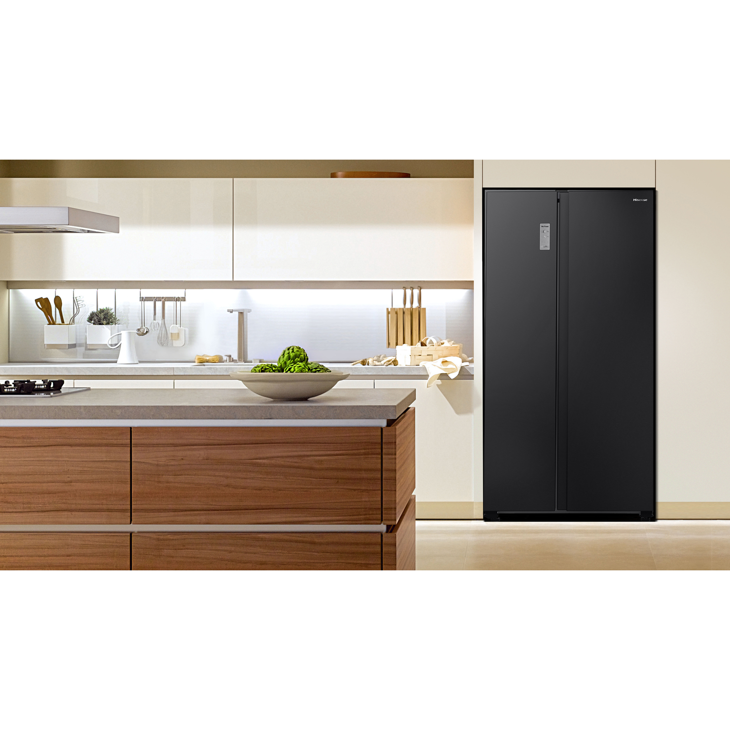 A modern kitchen with a black Hisense refrigerator. A wooden island holds a bowl of artichokes. Cabinets and accessories complete the scene.