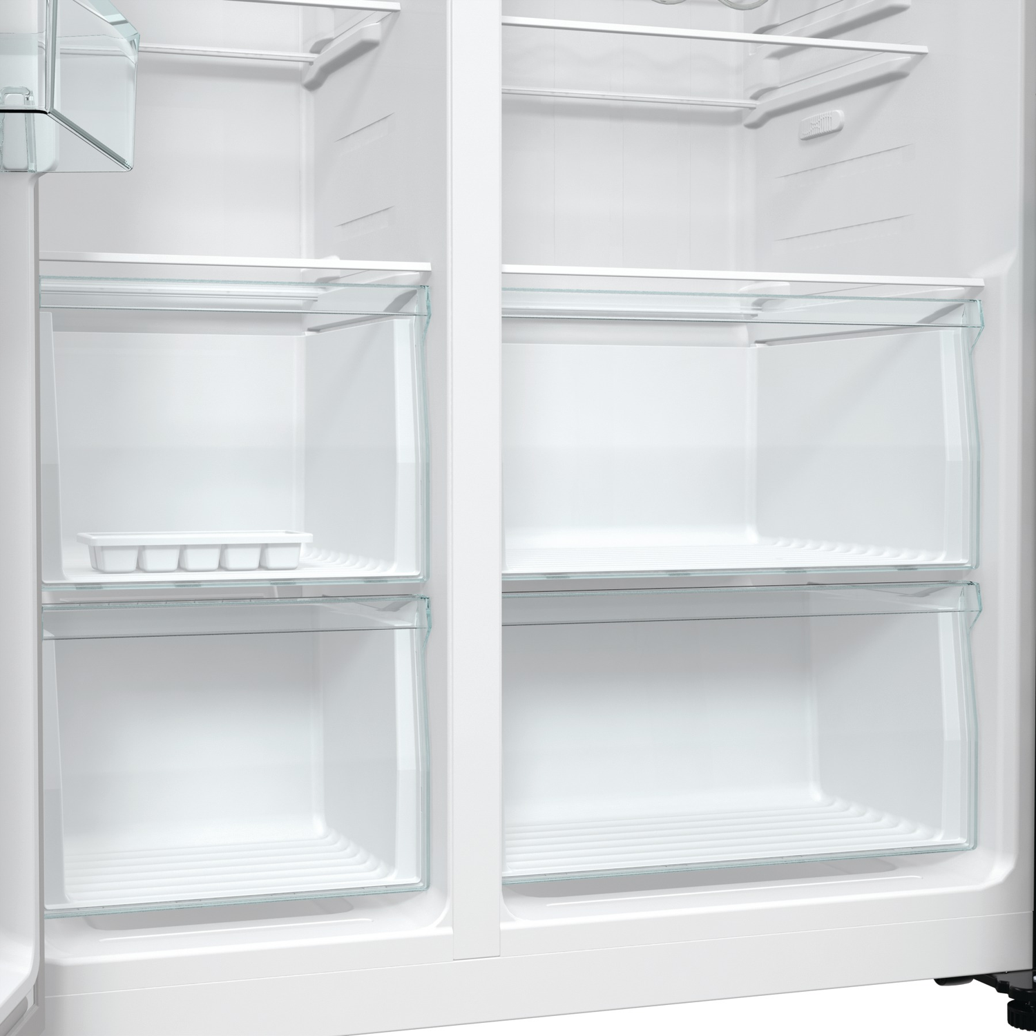 An empty white refrigerator interior with glass shelves and drawers. An ice cube tray sits on a shelf. The door is open.