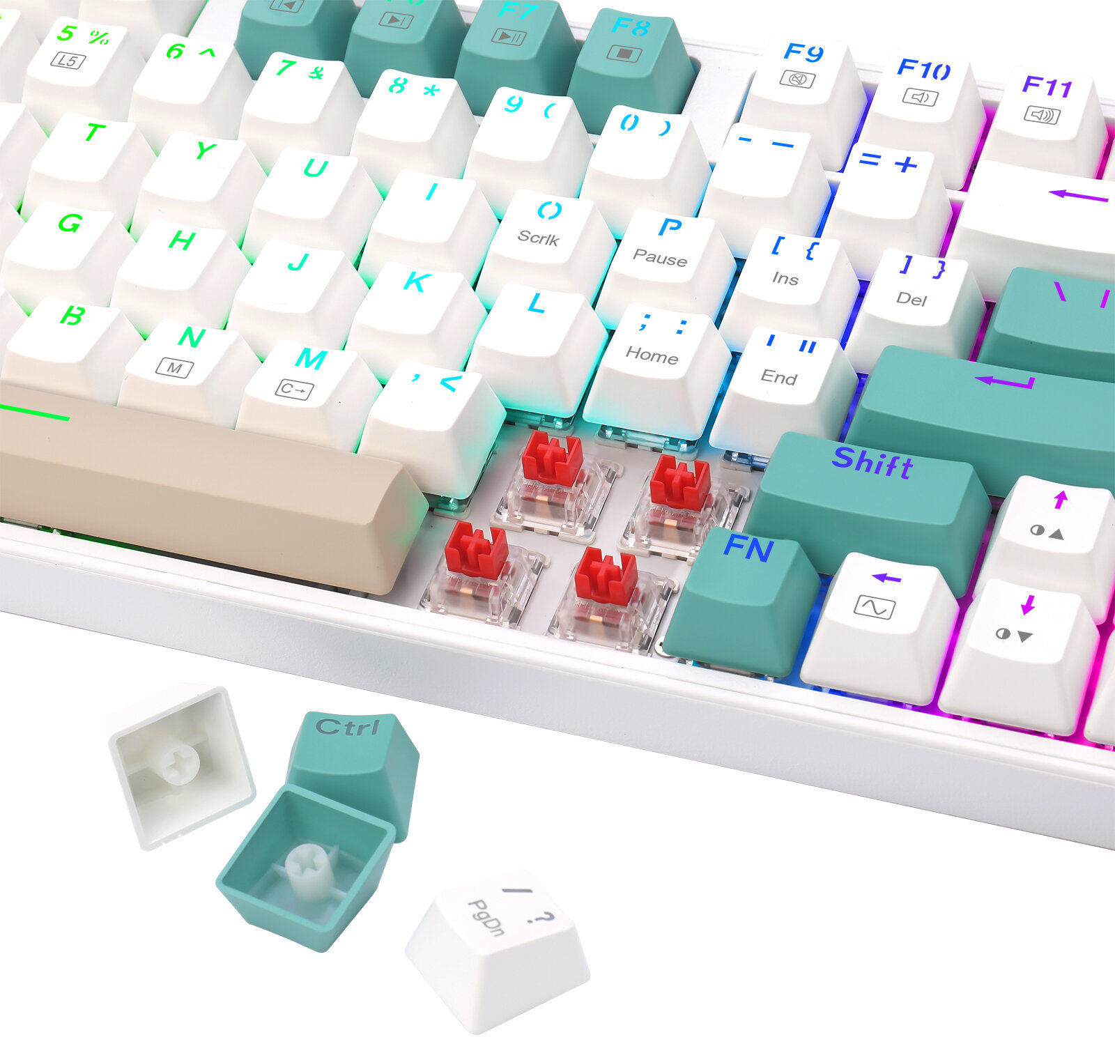 Biała klawiatura mechaniczna z turkusowymi i białymi klawiszami. Kilka klawiszy jest usuniętych, widać czerwone przełączniki.