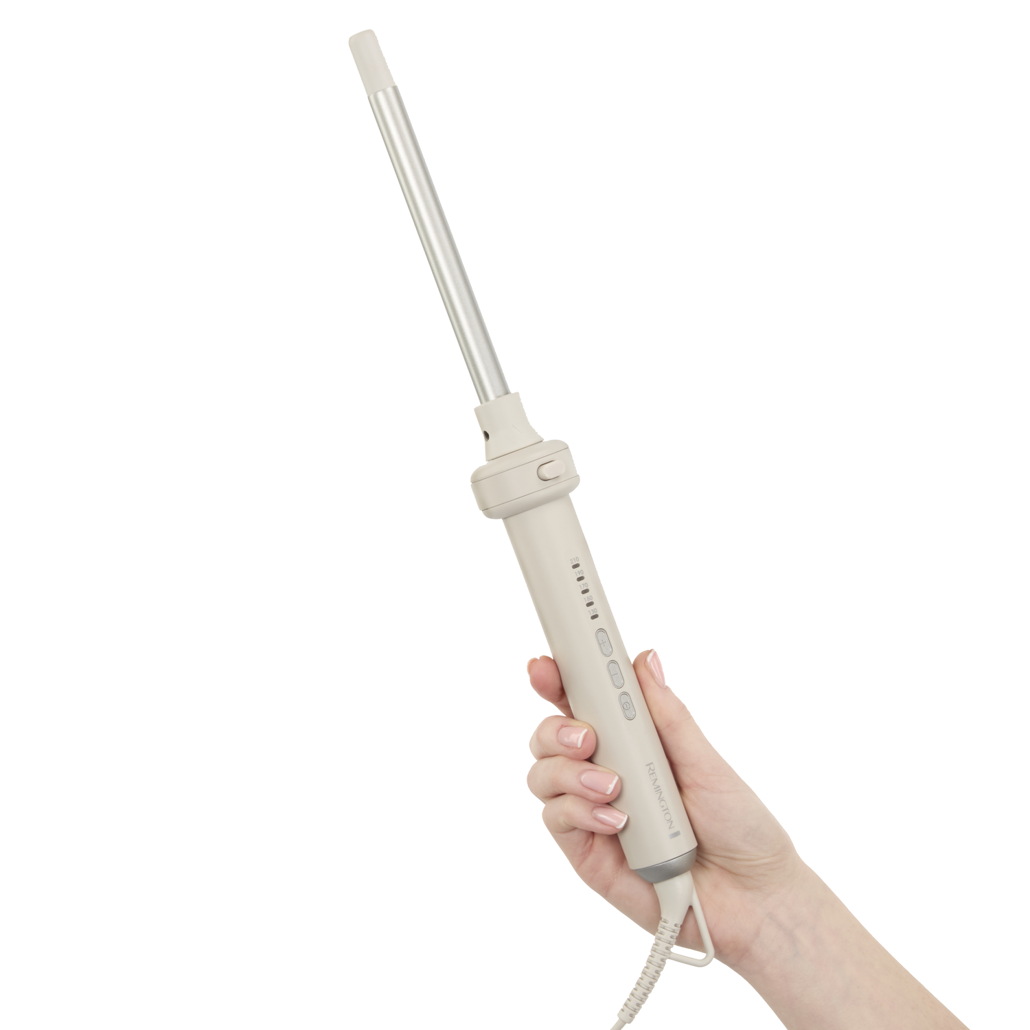 A hand holds a beige Remington curling iron against a white background. The iron is silver and beige, with buttons and a cord.