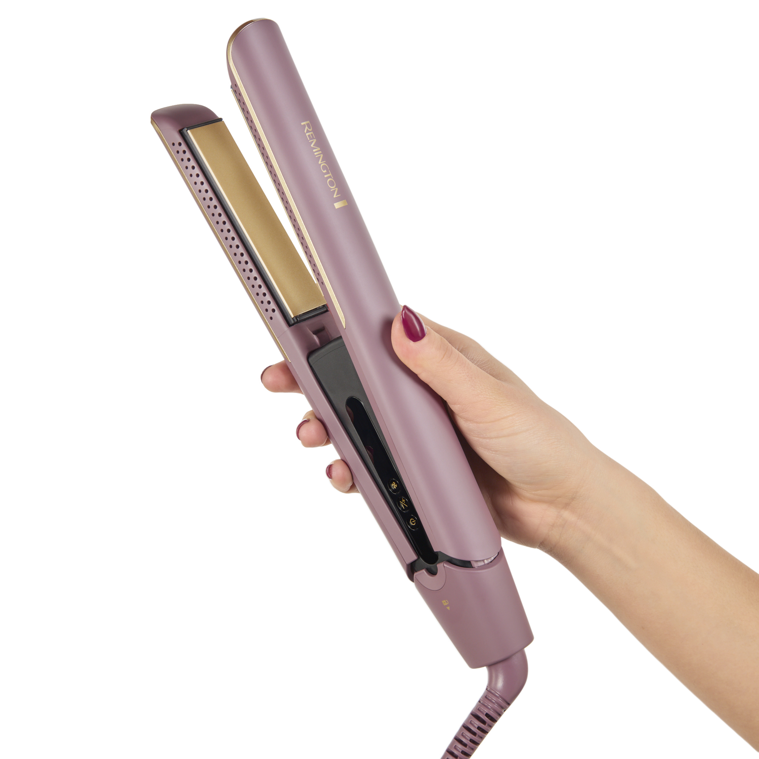 A woman's hand holds a purple Remington hair straightener, open, against a white background.