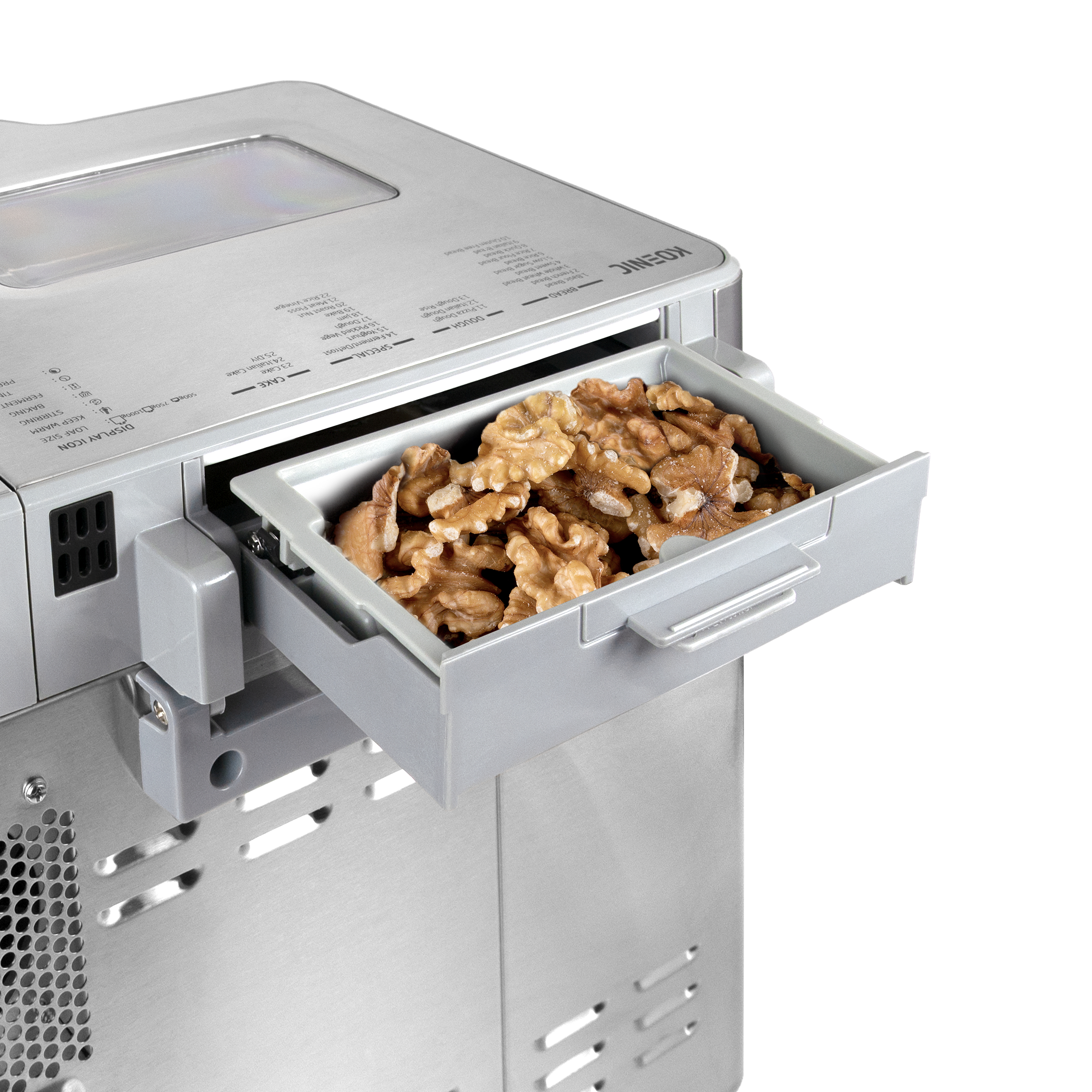 Ein Brotbackautomat mit einer Schale mit Walnüssen wird gezeigt. Die Maschine ist silberfarben, die Schale ist herausgezogen.