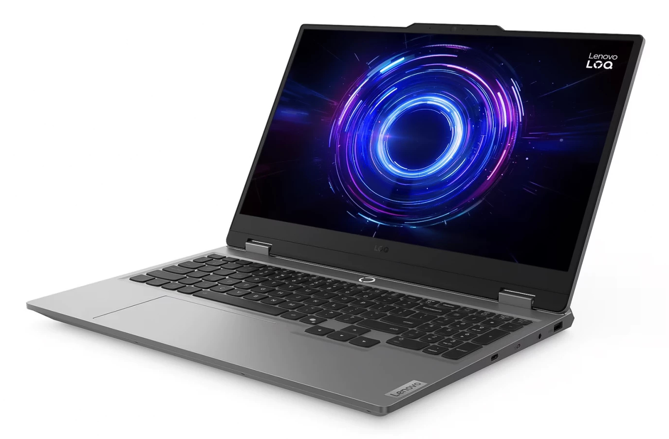 Laptop Lenovo jest otwarty, wyświetlając kolorową grafikę. Klawiatura jest widoczna. Laptop stoi na białej powierzchni.