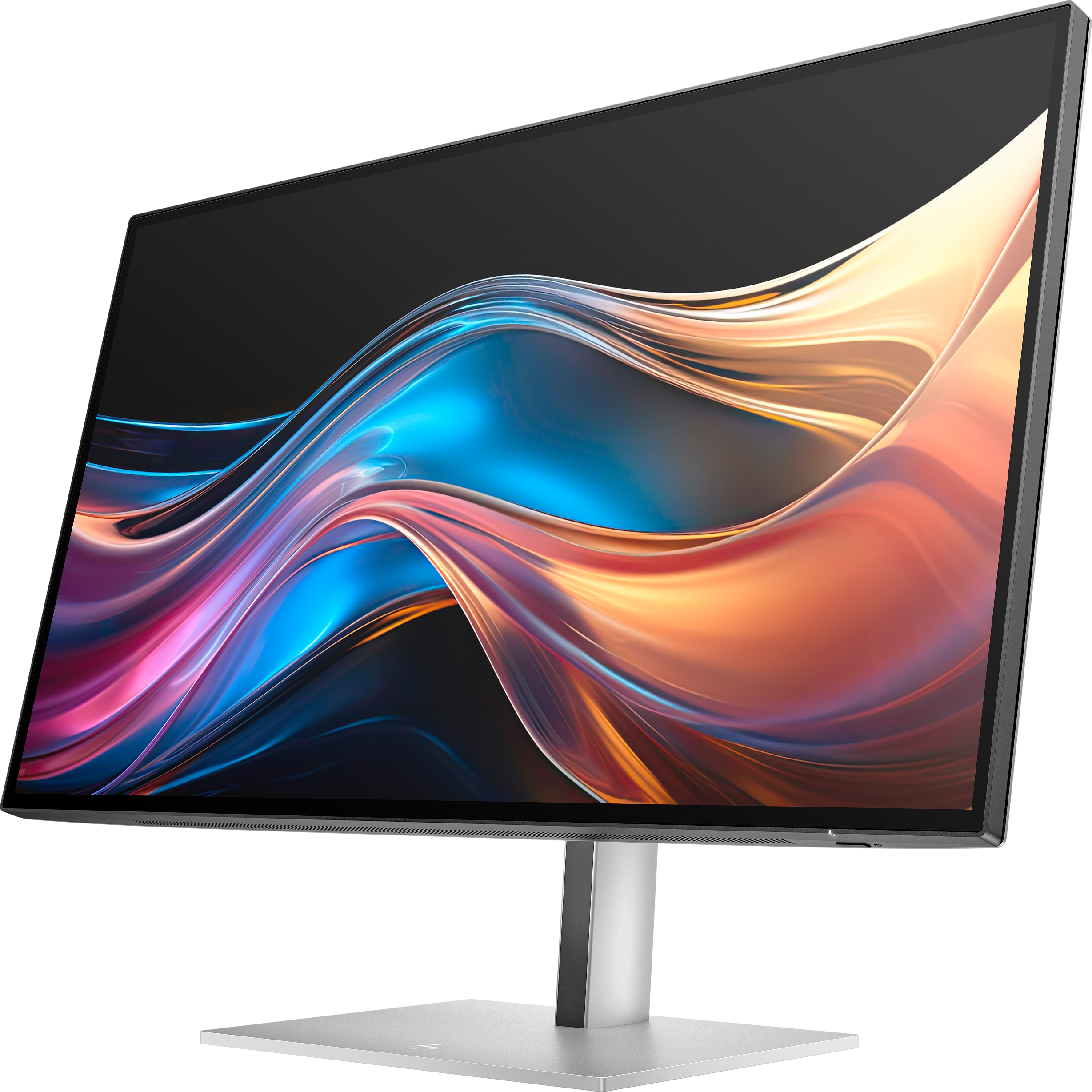 Ein Computermonitor zeigt ein abstraktes, farbenfrohes Design. Er hat einen silbernen Ständer und einen schwarzen Rahmen.