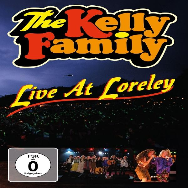 DVD-Cover von The Kelly Family Live At Loreley. Es zeigt eine Menge, eine Bühnenaufführung und einen Helikopter. Die FSK-Bewertung ist ebenfalls sichtbar.
