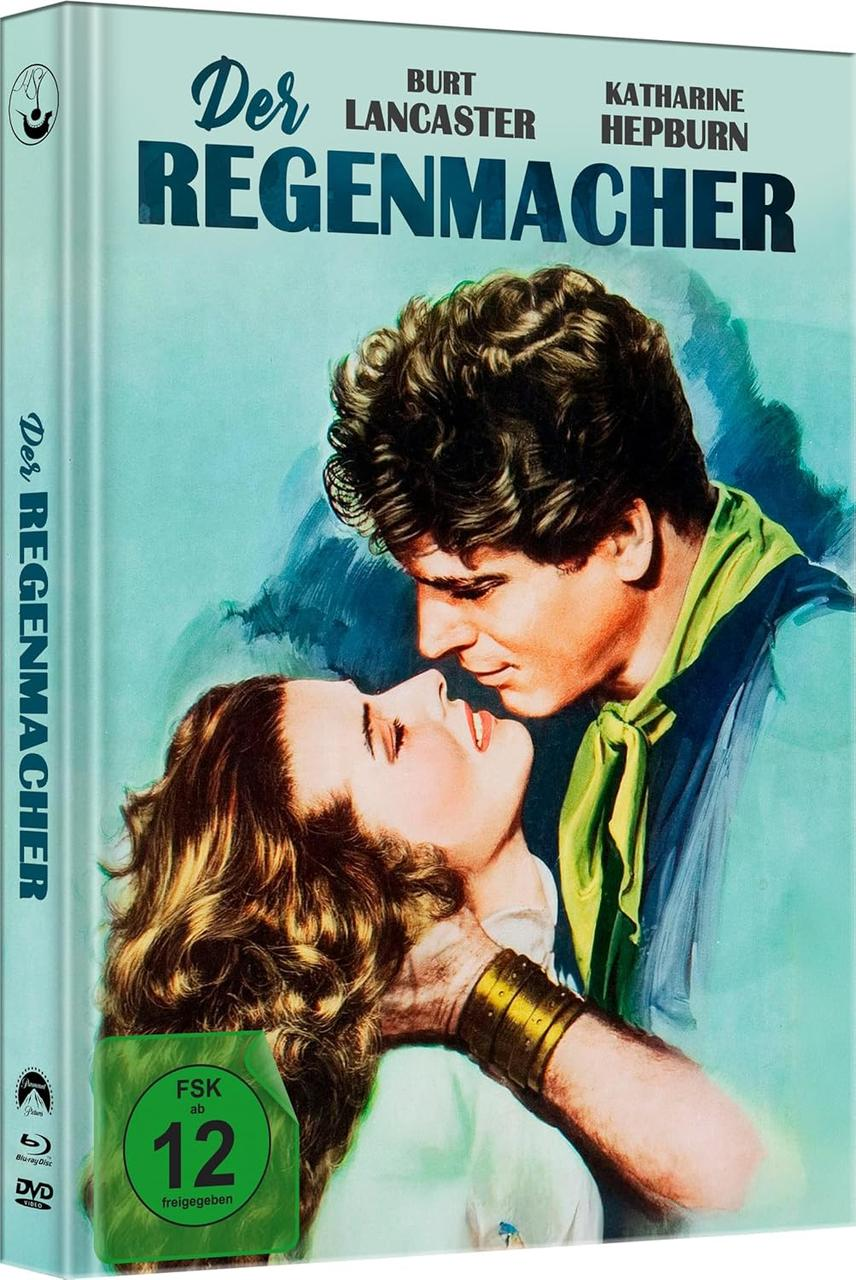 Filmcover: Burt Lancaster und Katharine Hepburn. Mann und Frau umarmen sich. Titel: Der Regenmacher. Grüner FSK 12 Aufkleber.