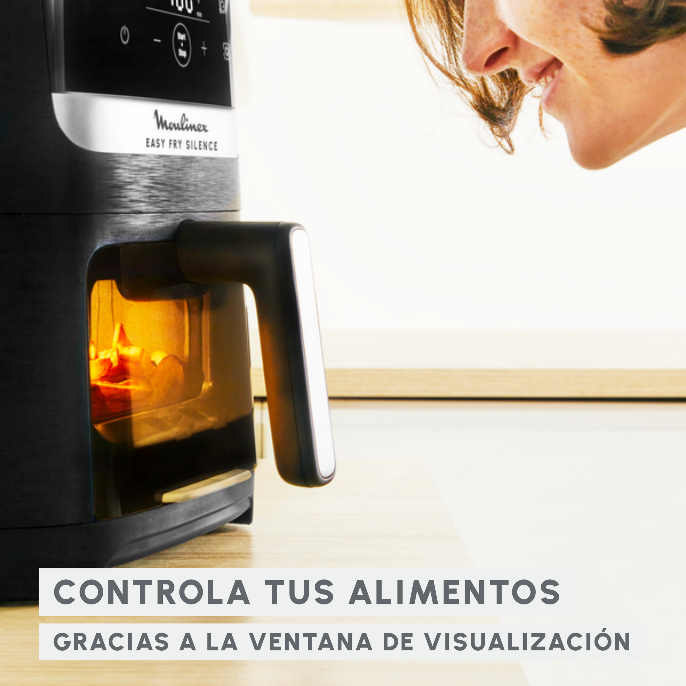 Una freidora de aire negra con ventana, rostro de mujer sonriente. Texto: 'Controla tus alimentos.'