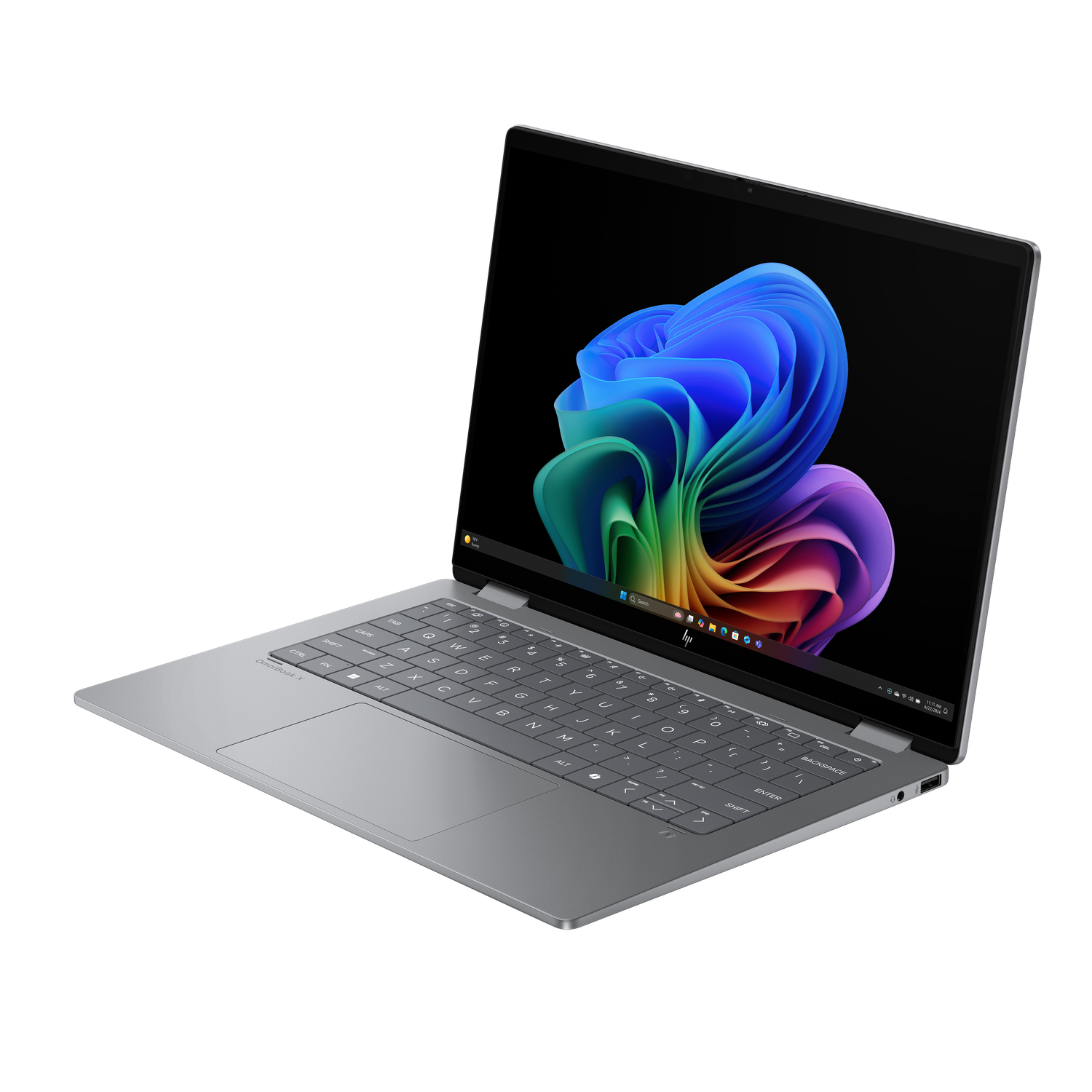 A gray laptop is open, displaying a colorful abstract image on the screen. The keyboard is visible, and the background is black.