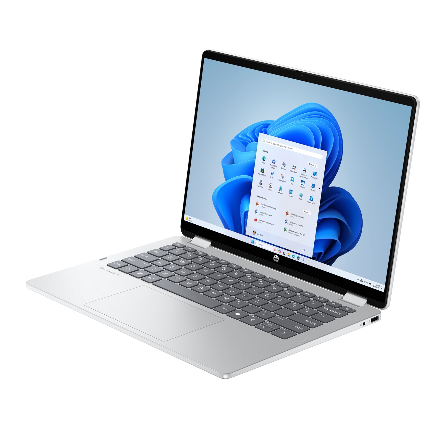 Silver HP laptop open, displaying Windows 11 interface. Keyboard and touchpad are visible. The screen shows app icons.