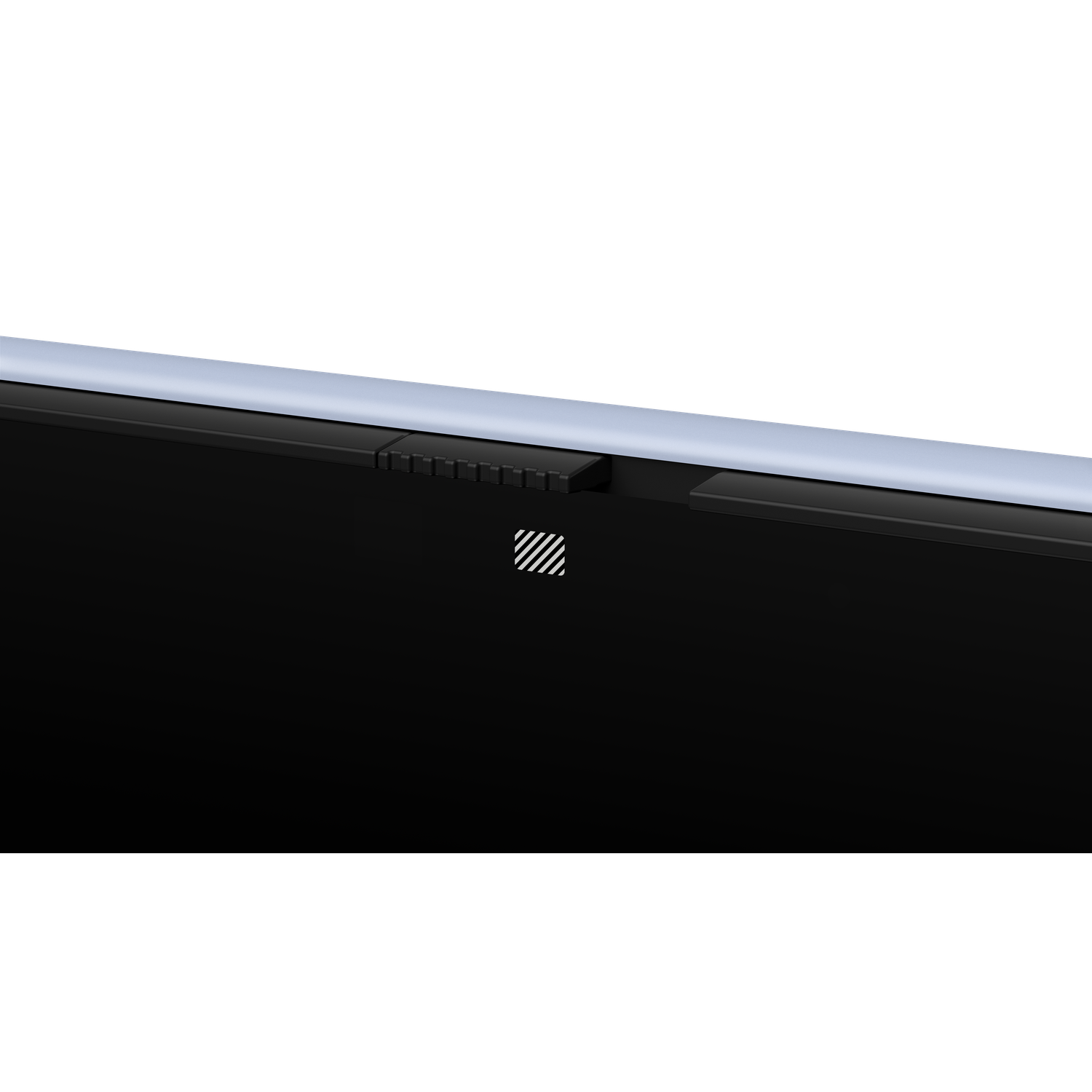 A close-up shot of a black laptop edge with a silver bar and a small, white and black striped design.