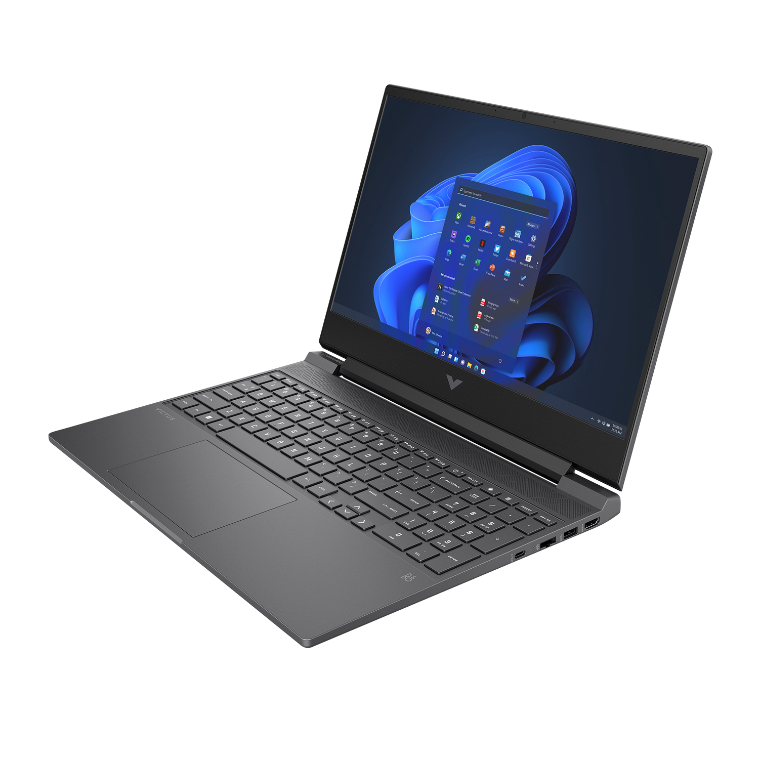 A gray laptop is open, displaying the Windows 11 interface. The screen shows app icons and a blue and black background. The keyboard is visible.