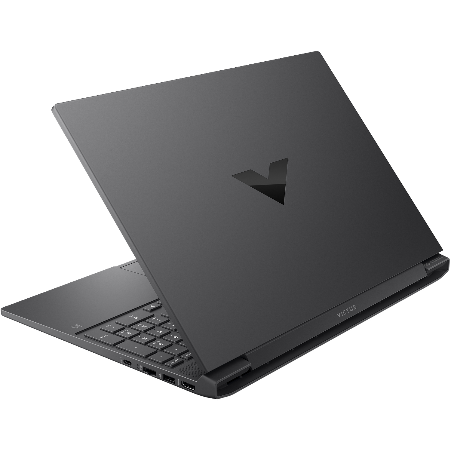 A dark gray laptop is slightly open, showing the keyboard and the screen. The brand name 'VICTUS' is visible on the laptop's edge.