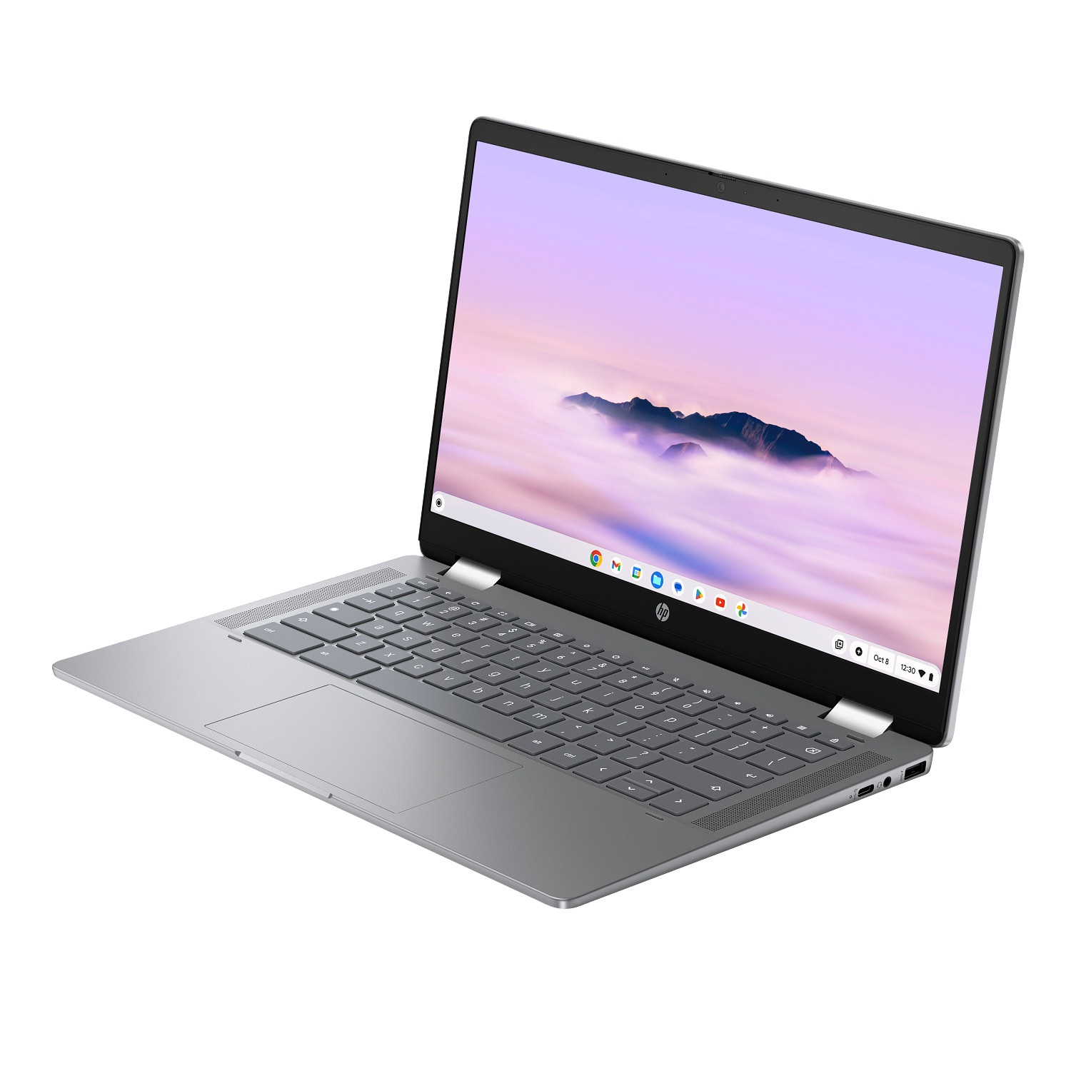 Silver HP laptop open, showing keyboard, touchpad, and screen with a cloudy mountain background.