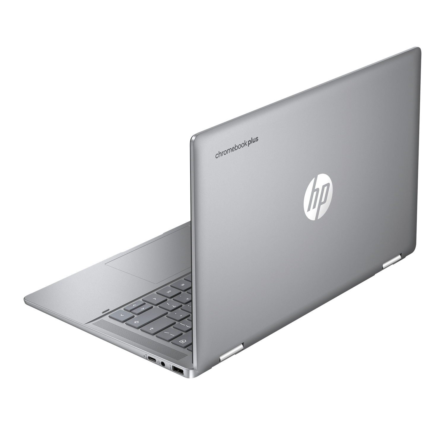 Silver HP Chromebook Plus laptop, open. Keyboard visible, HP logo on the lid. Black background.