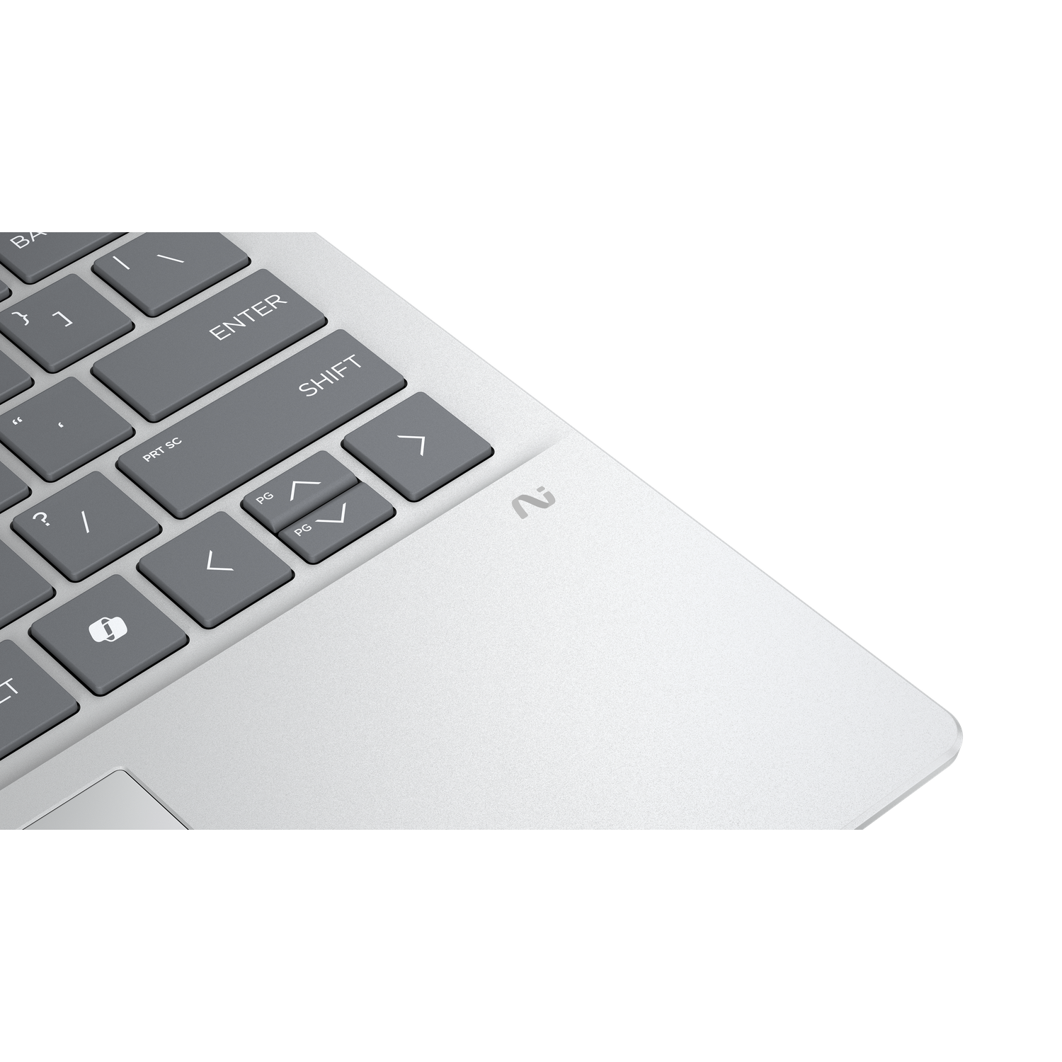 Close-up of a laptop keyboard with gray keys. The keys include Shift, Enter, and arrow keys. The laptop is silver.