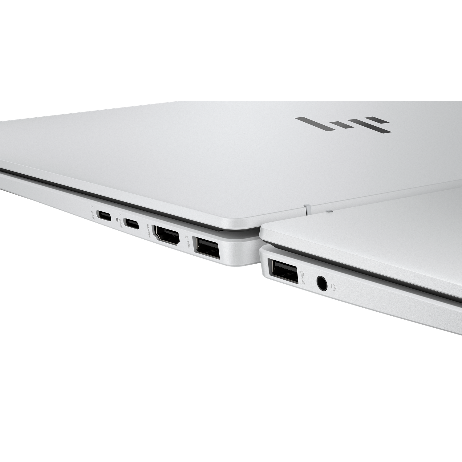 Close-up of two white laptops. Ports and the HP logo are visible. Black background.