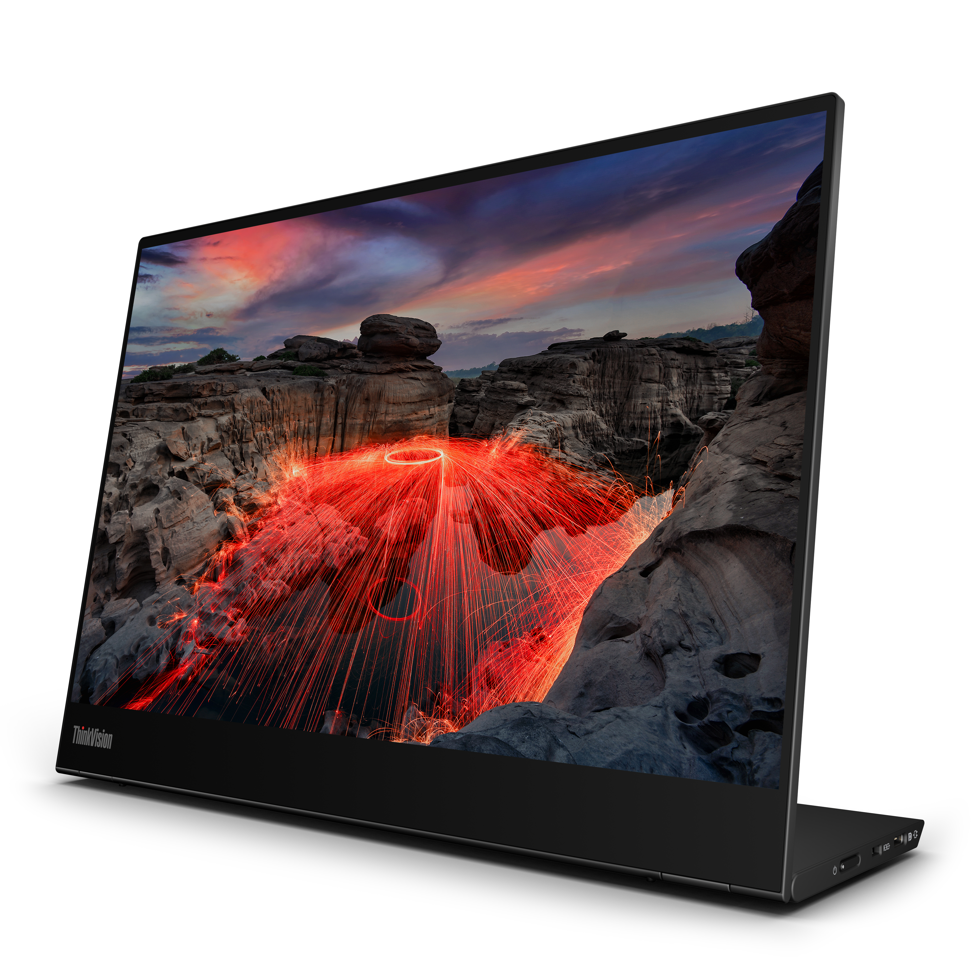 Schwarzer Laptop zeigt eine feurige Landschaft. Felsen und rote Funken dominieren die Szene, mit farbenfrohem Himmel.