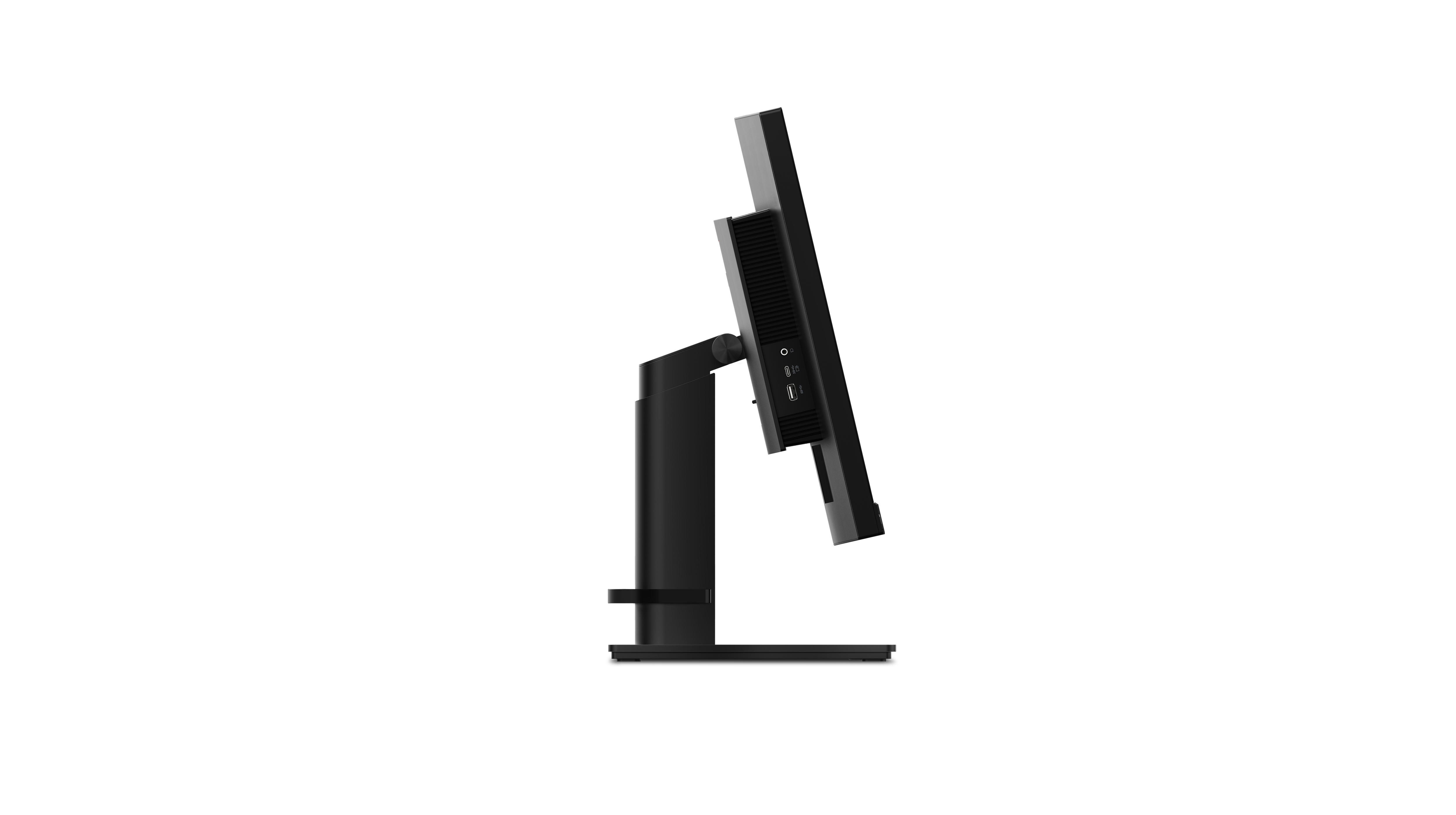 Ein schwarzer Computermonitor ist nach rechts abgewinkelt und zeigt Anschlüsse und einen Ständer. Der Hintergrund ist komplett schwarz.
