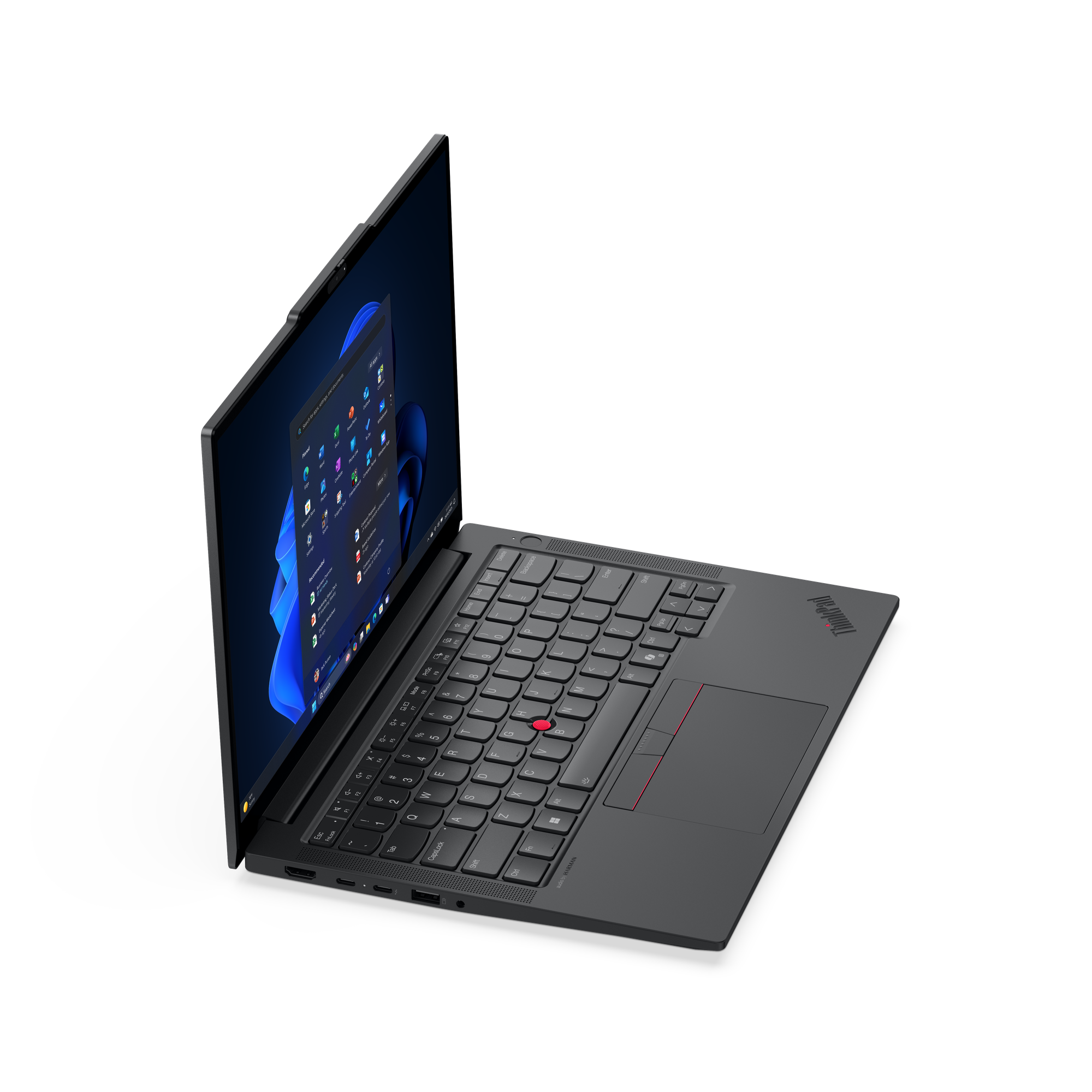 Egy sötétszürke laptop nyitva fekete felületen. A képernyő Windows felületet mutat.