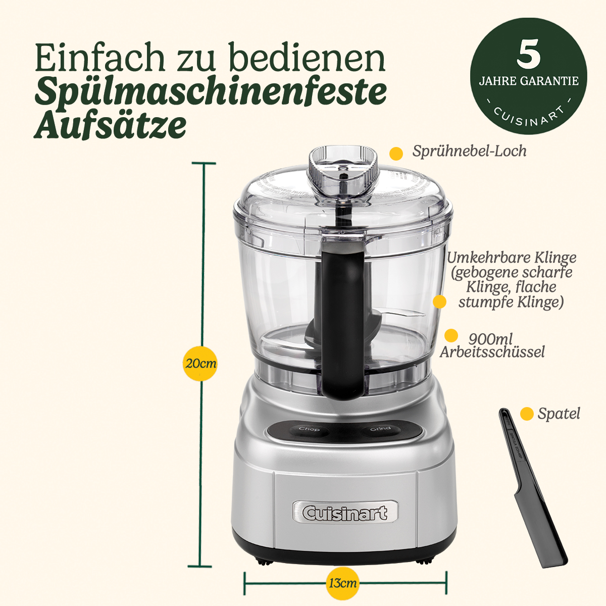 Ein silberner Cuisinart-Foodprozessor mit klarer Schüssel und schwarzer Klinge. Enthält einen Spatel und Messetiketten.