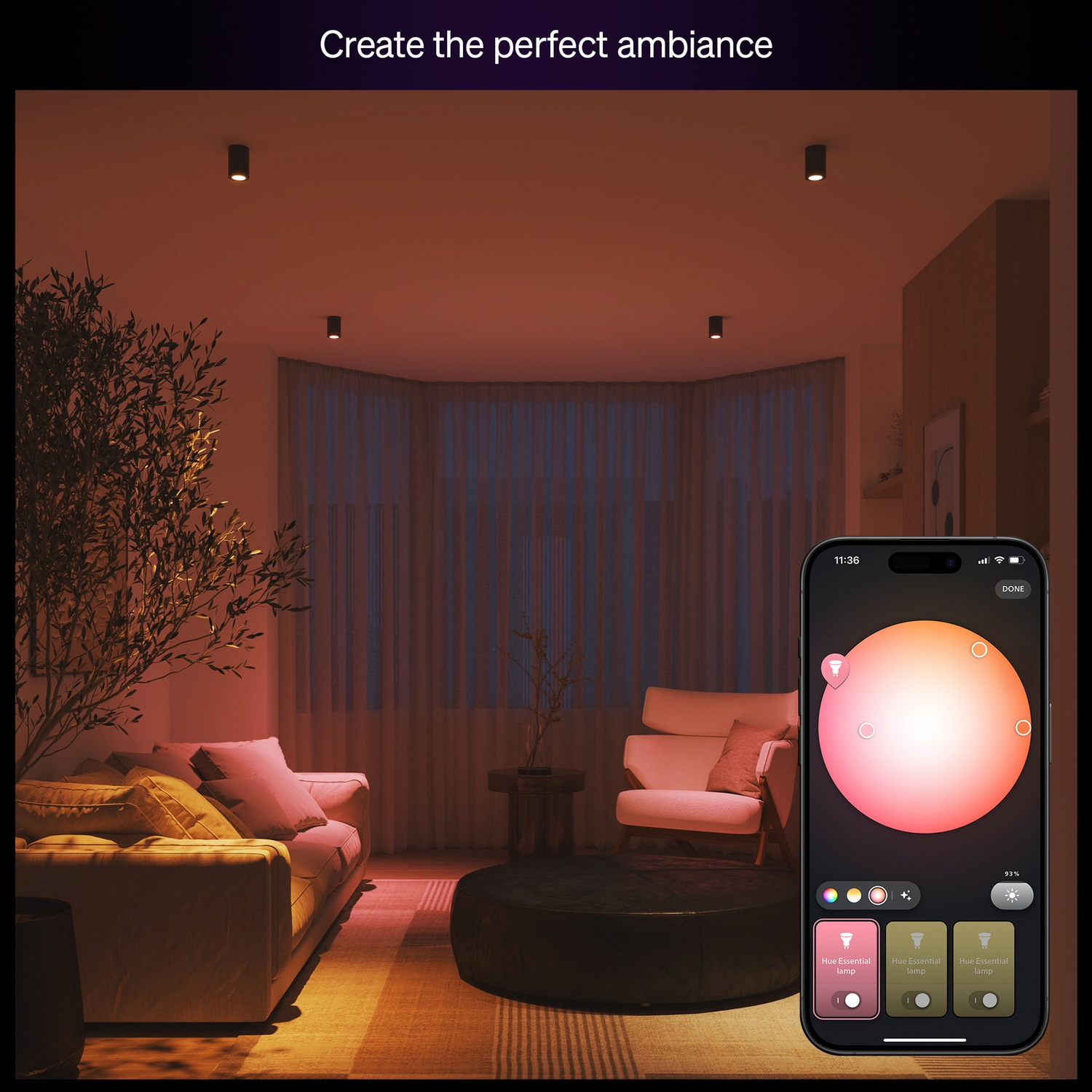A living room with lights and a smartphone showing light controls. There is a sofa, armchair, and a coffee table, and the ambiance is warm.