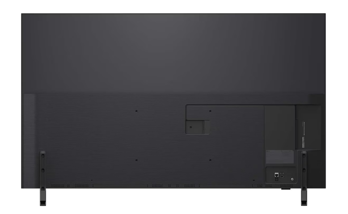 Büyük siyah bir televizyonun arkası. Bağlantı noktaları ve bir güç kaynağı var. İki ayak TV'yi destekliyor.