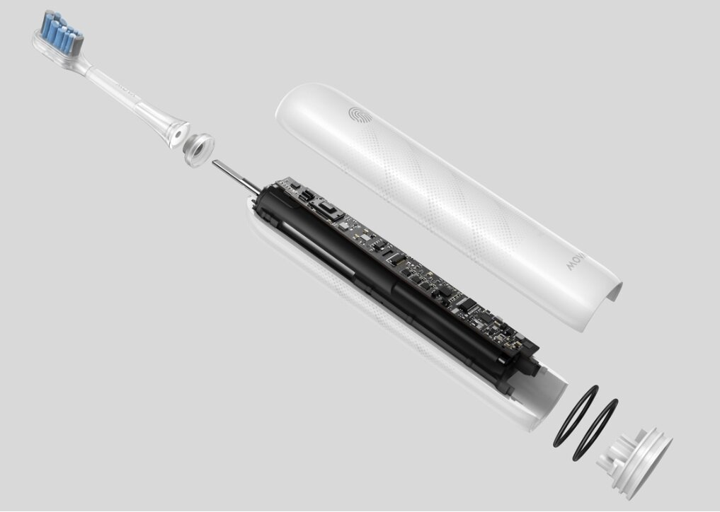 Widok rozstrzelony szczoteczki elektrycznej. Komponenty obejmują główkę szczoteczki, korpus i obwody wewnętrzne, wszystko na szarym tle.