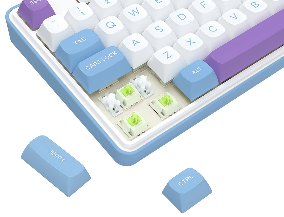 Zbliżenie klawiatury mechanicznej. Widoczne białe, niebieskie i fioletowe klawisze. Niektóre klawisze są usunięte, widać przełączniki.
