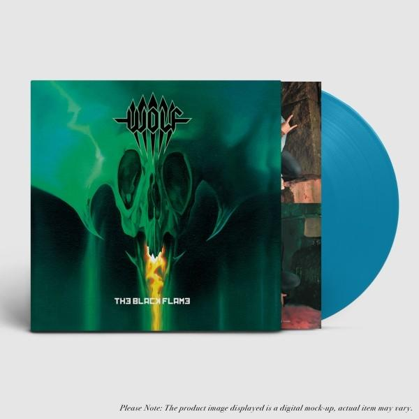 Albumcover: grünes Schädeldesign, der Bandname 'WOLF' und der Text 'THE BLACK FLAME'. Eine blaue Vinylplatte ist teilweise sichtbar.