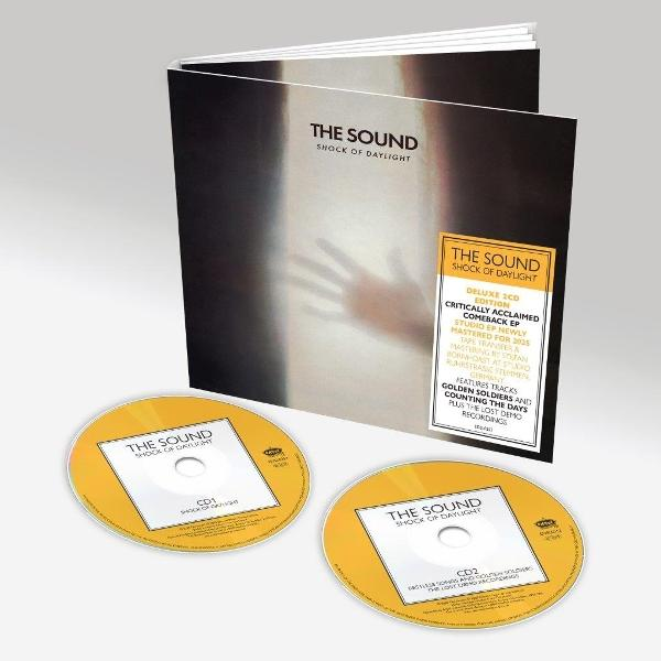 Albumcover mit zwei CDs. Das Cover zeigt eine Handsilhouette. Text lautet 'The Sound Shock of Daylight'. CDs sind gelb mit weißem Text.