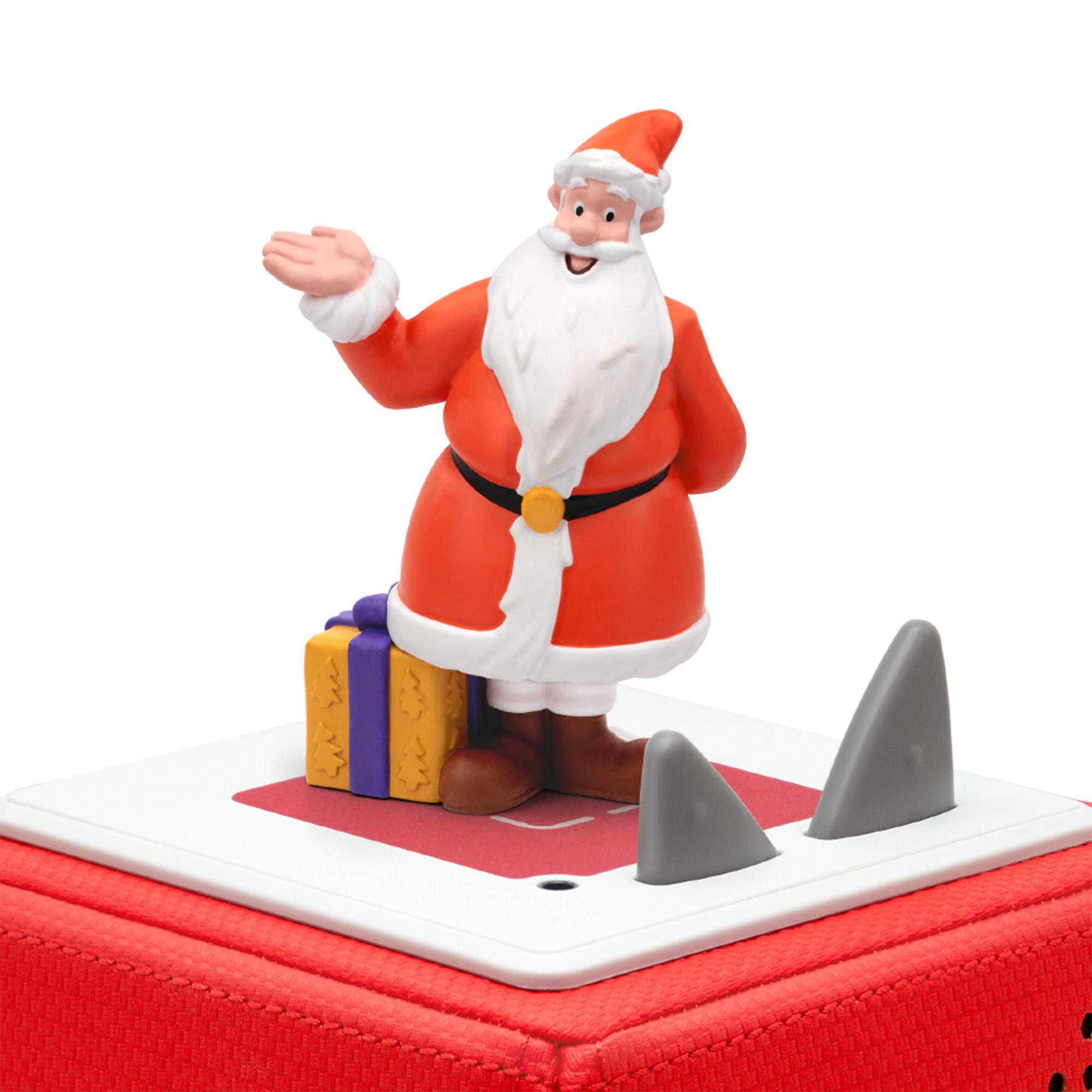 Weihnachtsmann-Figur mit Geschenk und Haifischflossen. Der Weihnachtsmann trägt einen roten Anzug, einen weißen Bart und Hut. Die Basis ist rot.