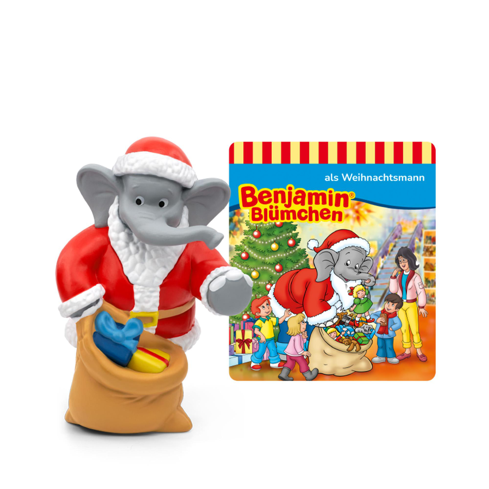 Eine Elefantenfigur im Weihnachtsmann-Outfit steht neben einem Buchcover mit dem Titel 'Benjamin Blümchen als Weihnachtsmann'.