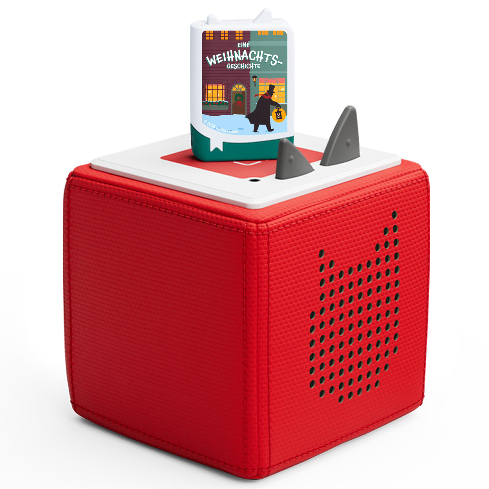 Roter Würfel mit weißer Oberseite, einem Buch mit dem Titel „Eine Weihnachtsgeschichte“ und zwei grauen Haifischflossen.