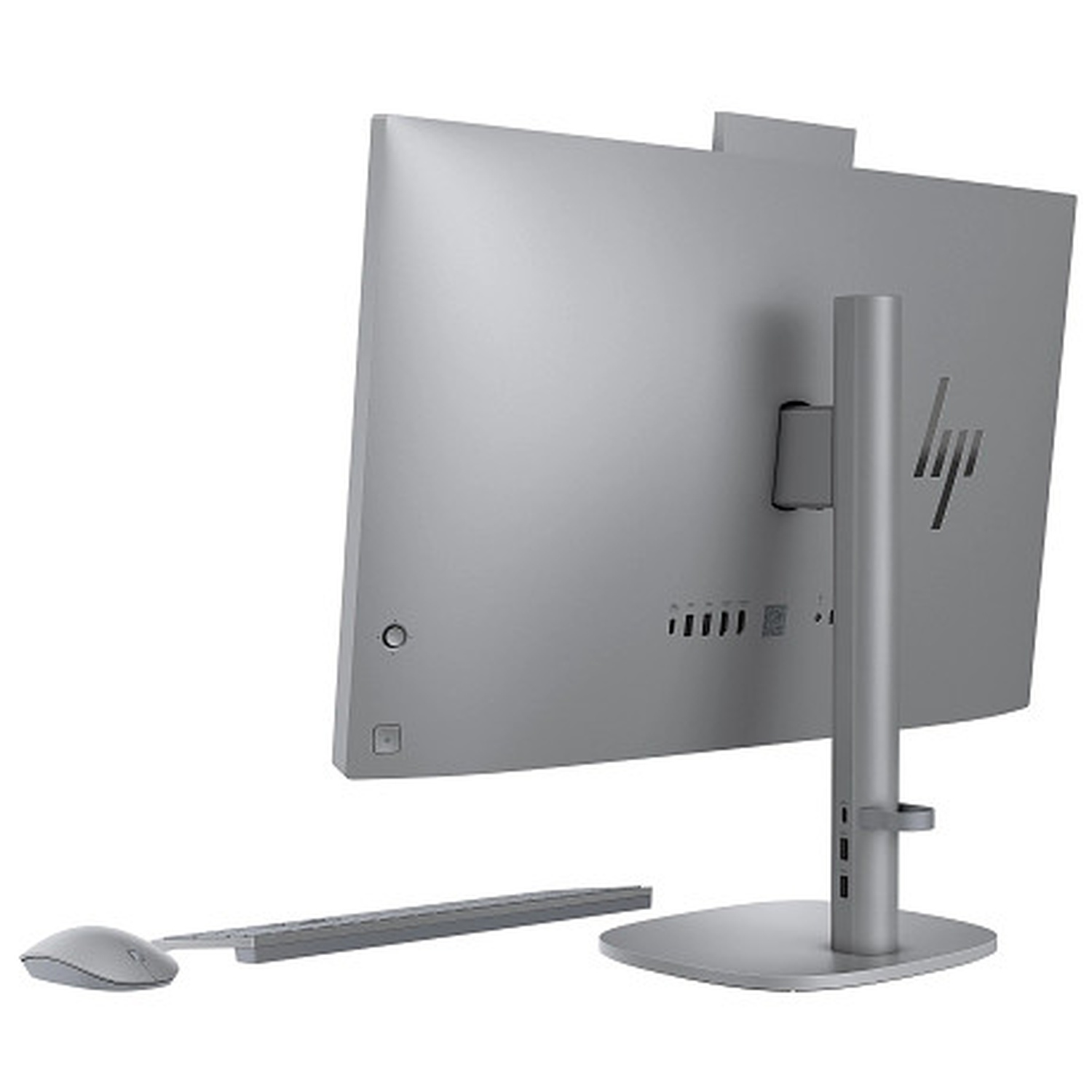 Vue arrière d'un ordinateur HP tout-en-un argenté. Comprend un moniteur, un support, un clavier et une souris. Le logo HP est visible.