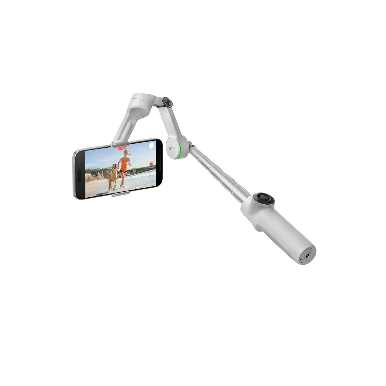 A white phone stabilizer holds a smartphone displaying a person running with a dog on a beach. The stabilizer is extended.