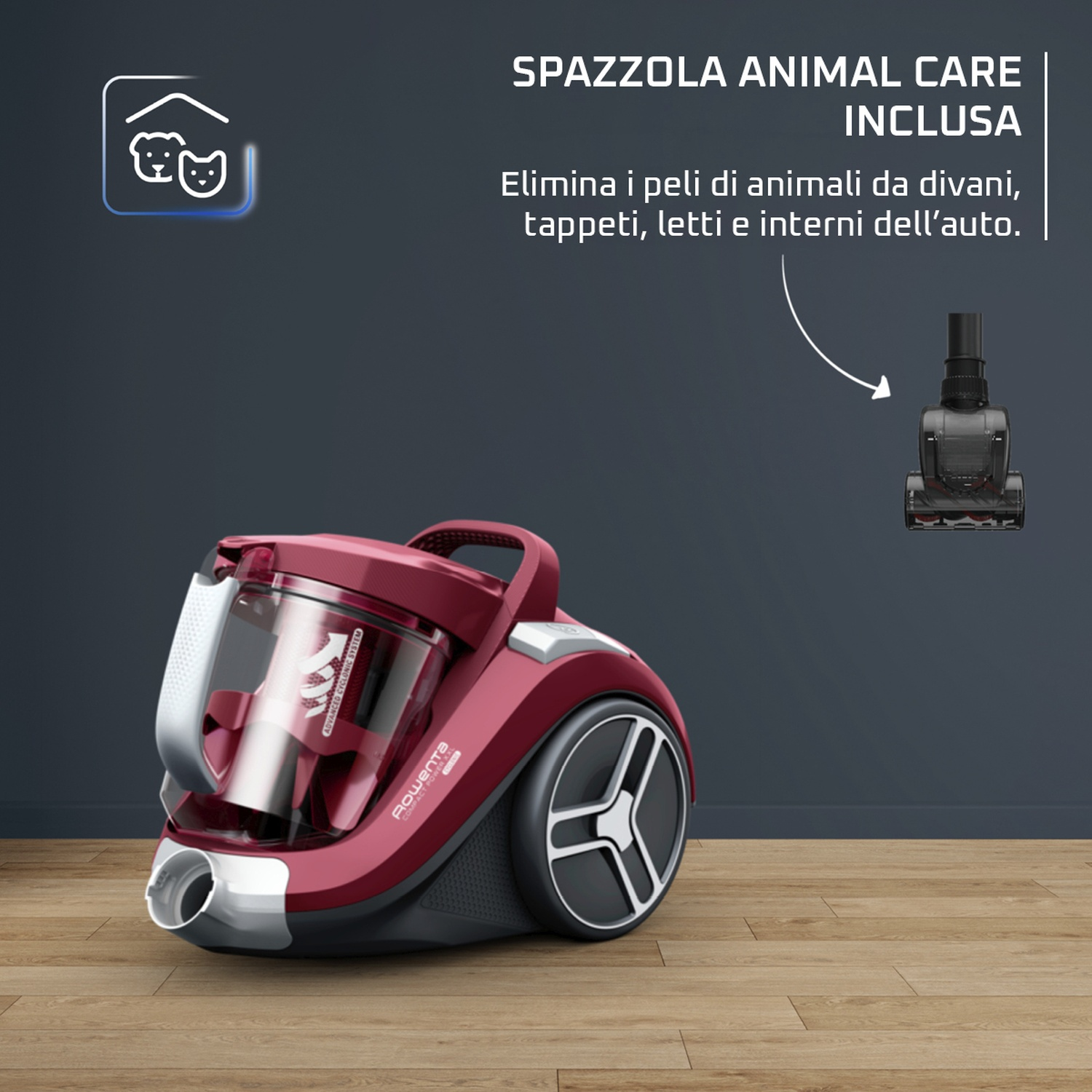 Un aspirapolvere rosso con un contenitore per la polvere trasparente è su un pavimento di legno. Il testo dice 'Animal Care Included' e 'Elimina i peli degli animali'.