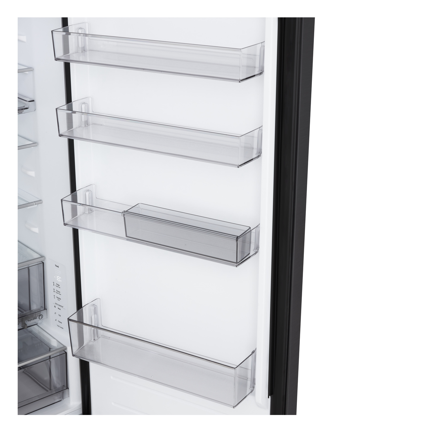 Inside a refrigerator door, clear plastic shelves are visible. The door frame is black. The inside walls are white.