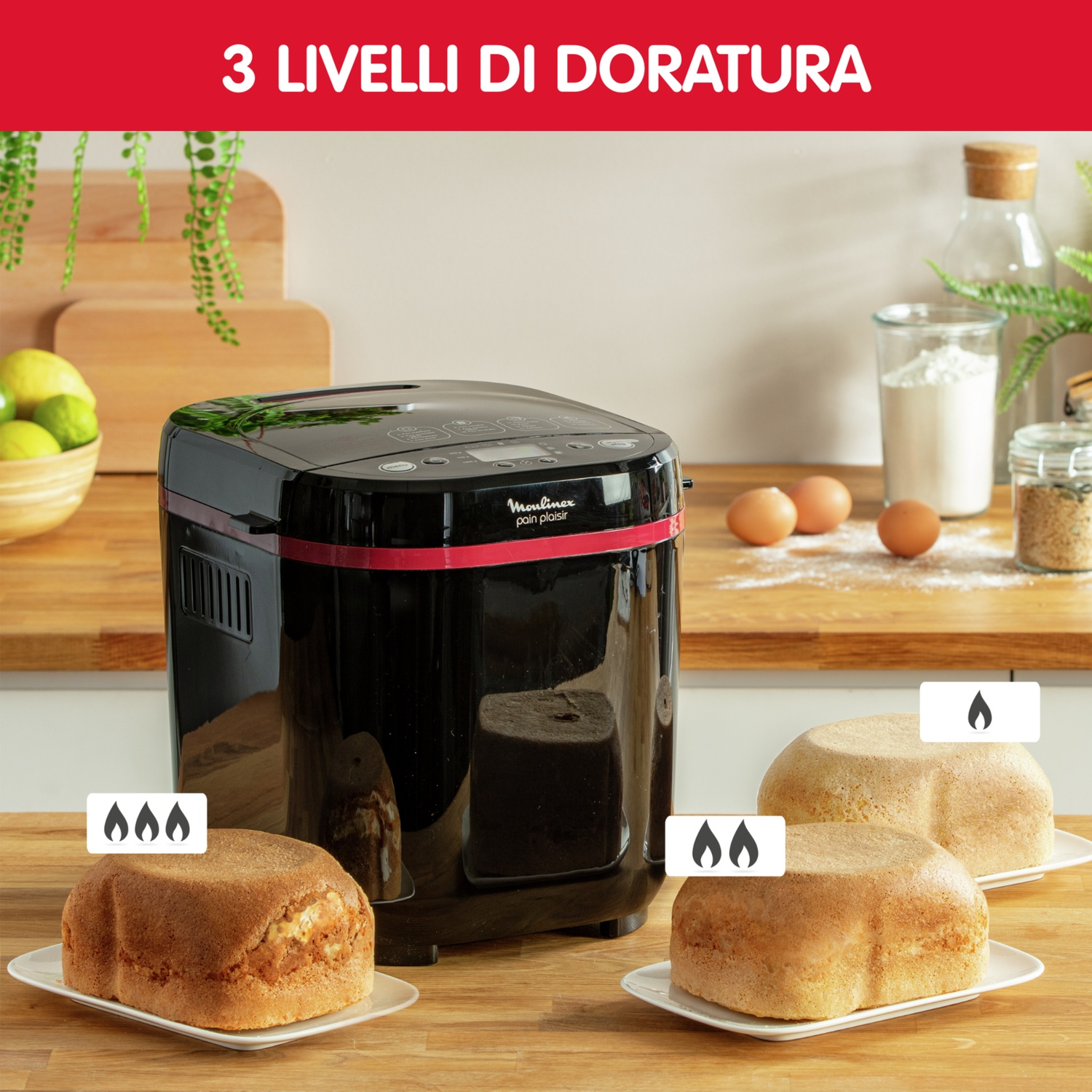 Una macchina per il pane con tre pagnotte che mostrano diversi livelli di doratura. Sono visibili anche ingredienti come farina, uova e limoni.