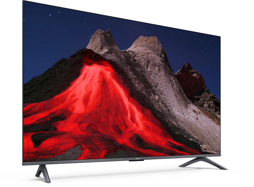 A TV egy hegyvidéki tájat jelenít meg vörös lávával. A TV fekete, ezüst szegéllyel, ezüst lábakon áll.