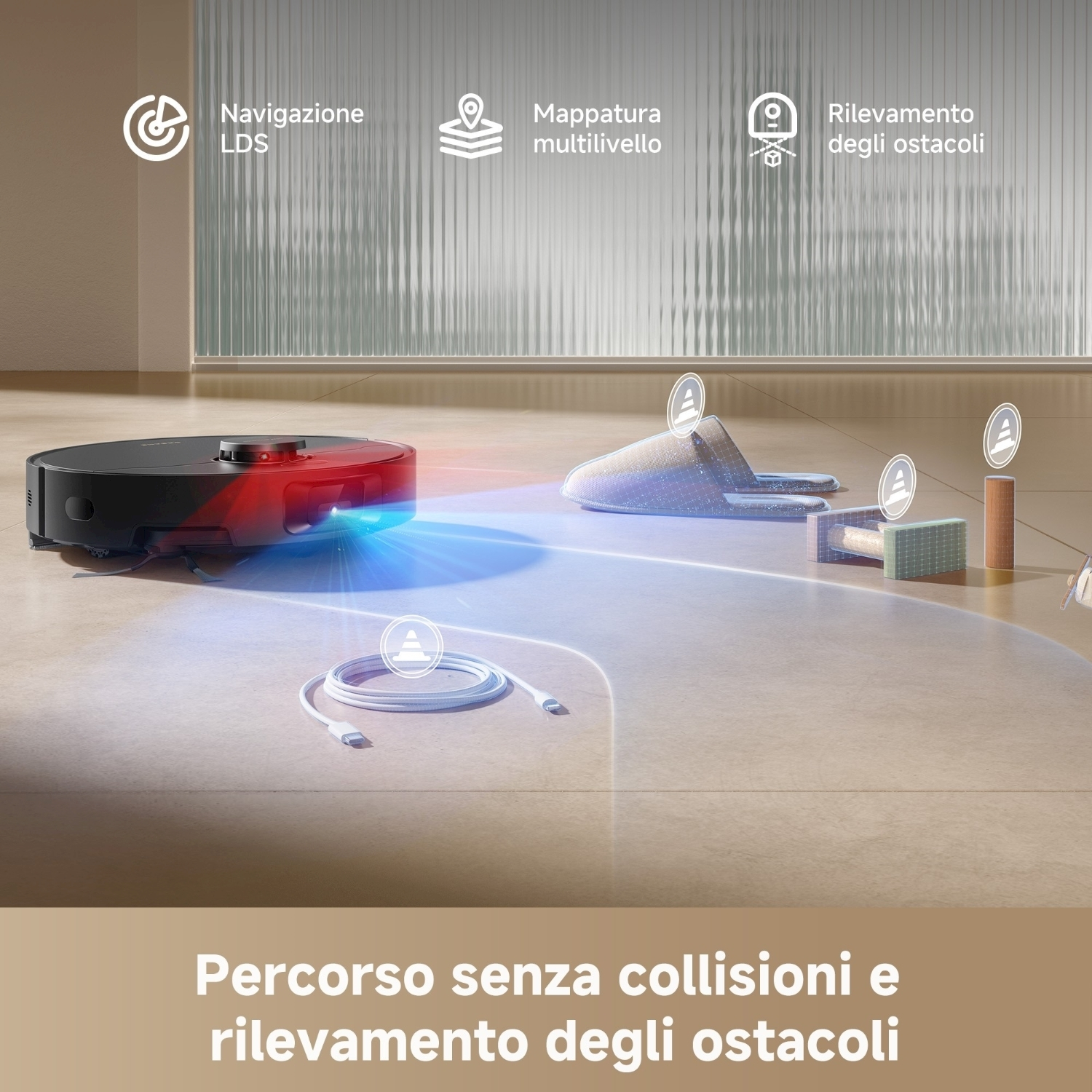 Un aspirapolvere robot nero con luci rosse e blu pulisce una stanza. Ci sono pantofole, un cavo e altri oggetti.