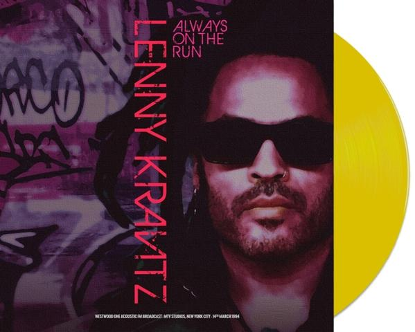 Lenny Kravitz album borítója, sárga bakelit lemezzel. Kravitz napszemüvegben, graffitis háttérrel és szöveggel.