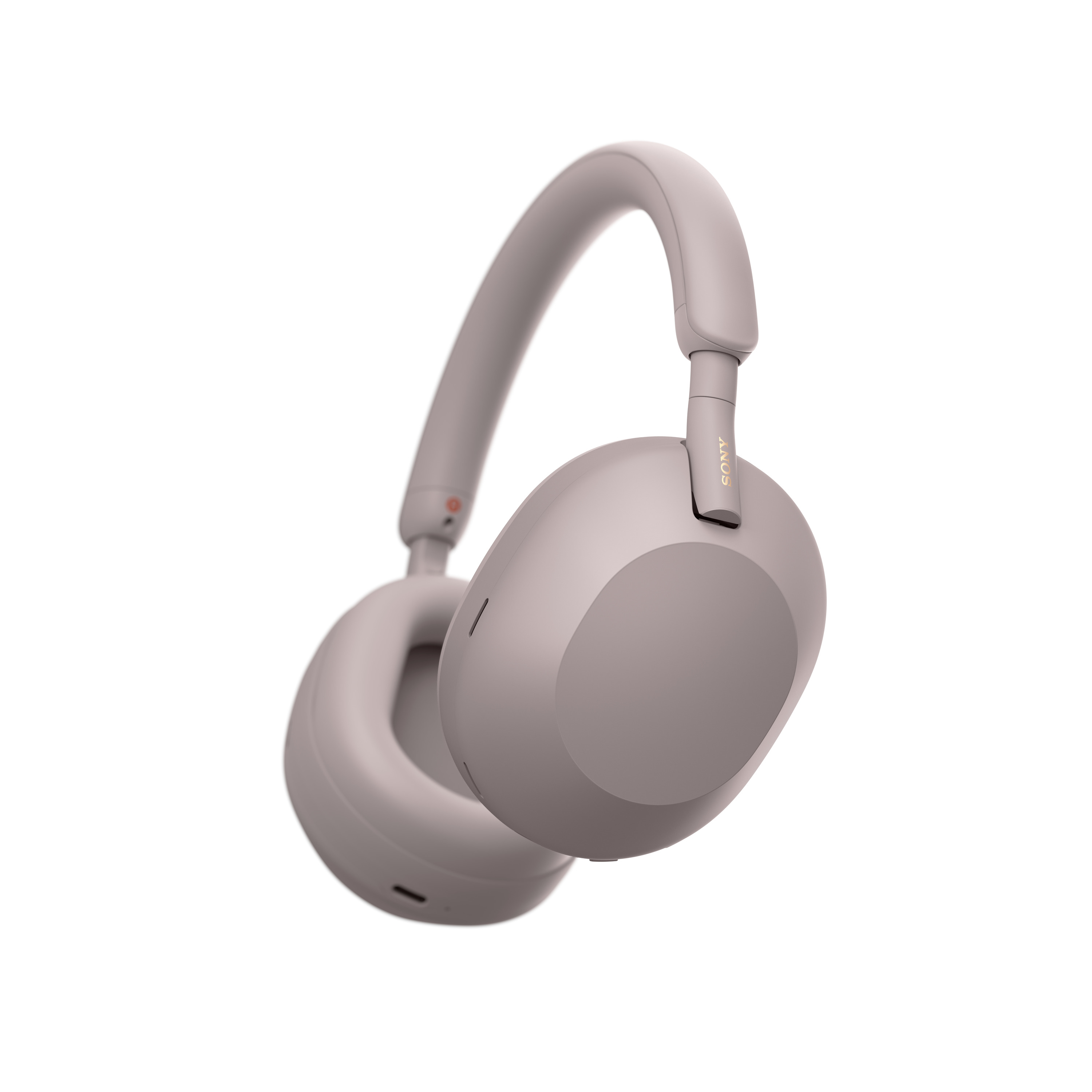 Egy világos lila Sony fejhallgató, fehér háttér előtt lebegve. A Sony logó látható az oldalán.