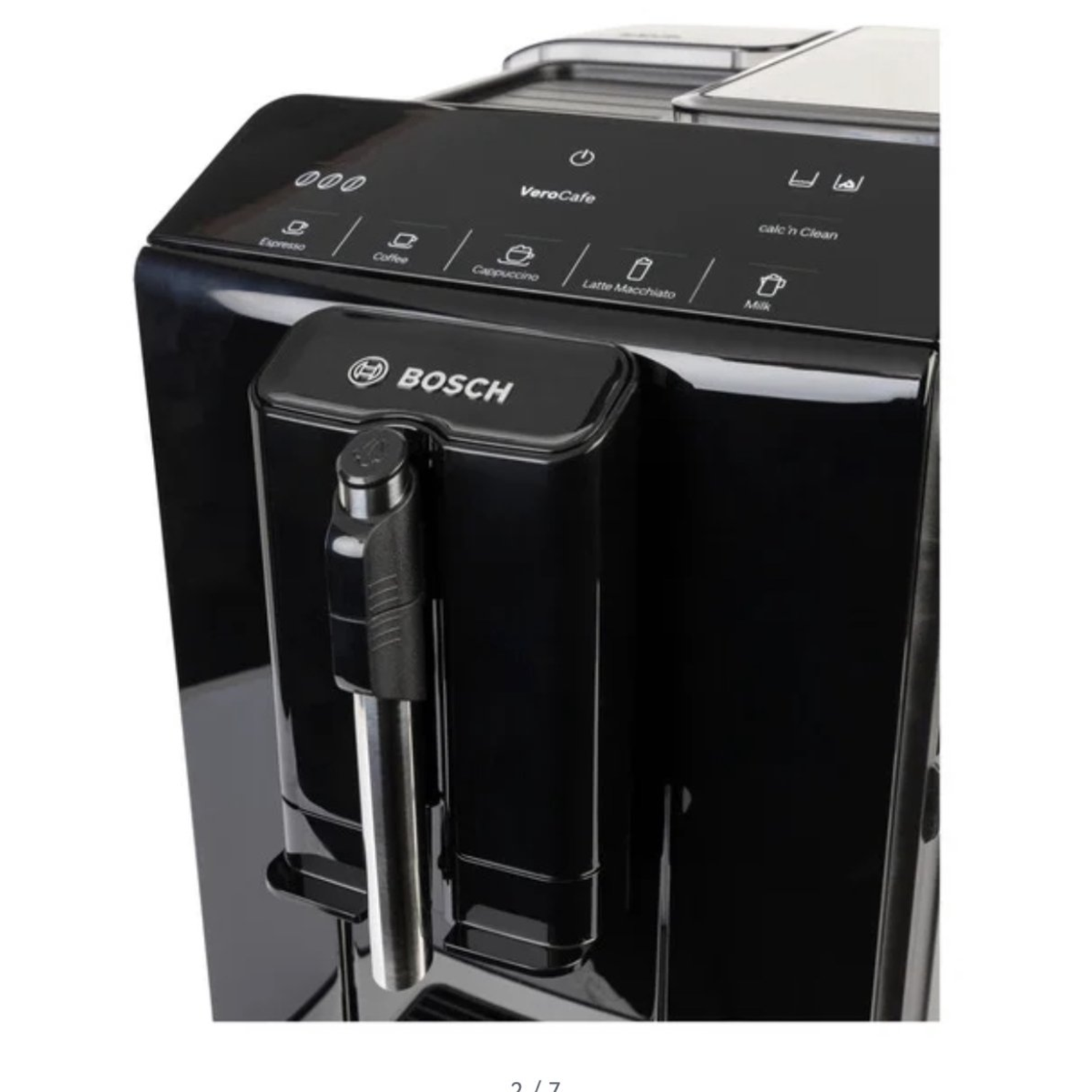 A black Bosch VeroCafe coffee machine. Features include buttons for espresso, coffee, cappuccino, and latte. It also has a milk frothing wand.