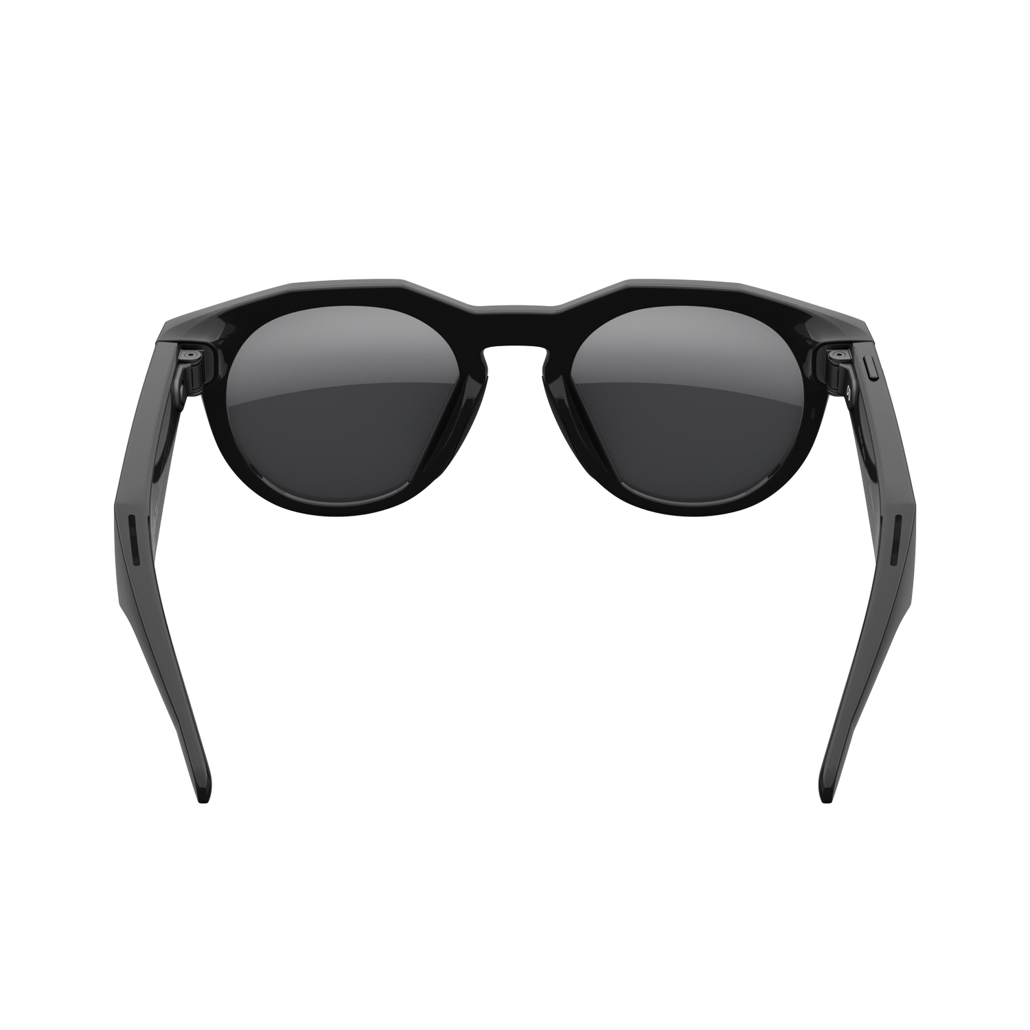 Gafas de sol negras con lentes redondas centradas en un fondo gris. Las gafas tienen monturas gruesas y patillas hacia afuera.