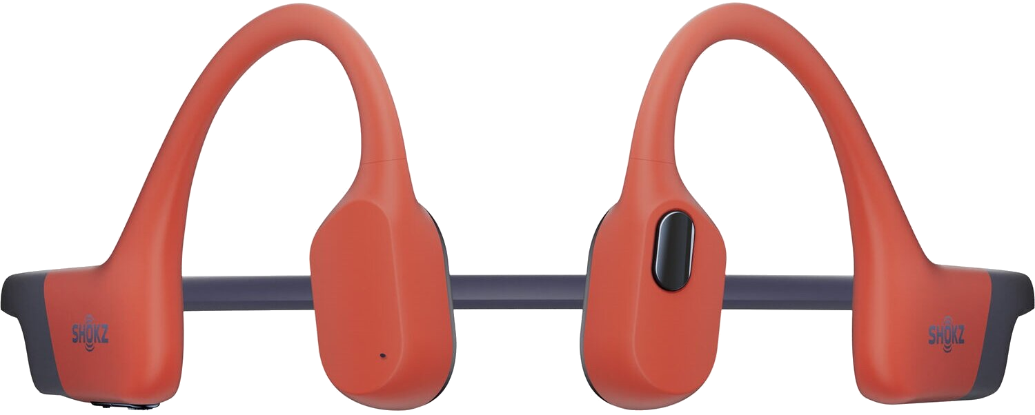 Pomarańczowe słuchawki kostne Shokz. Mają ciemnoszarą opaskę i wkładki douszne z czarnym przyciskiem.