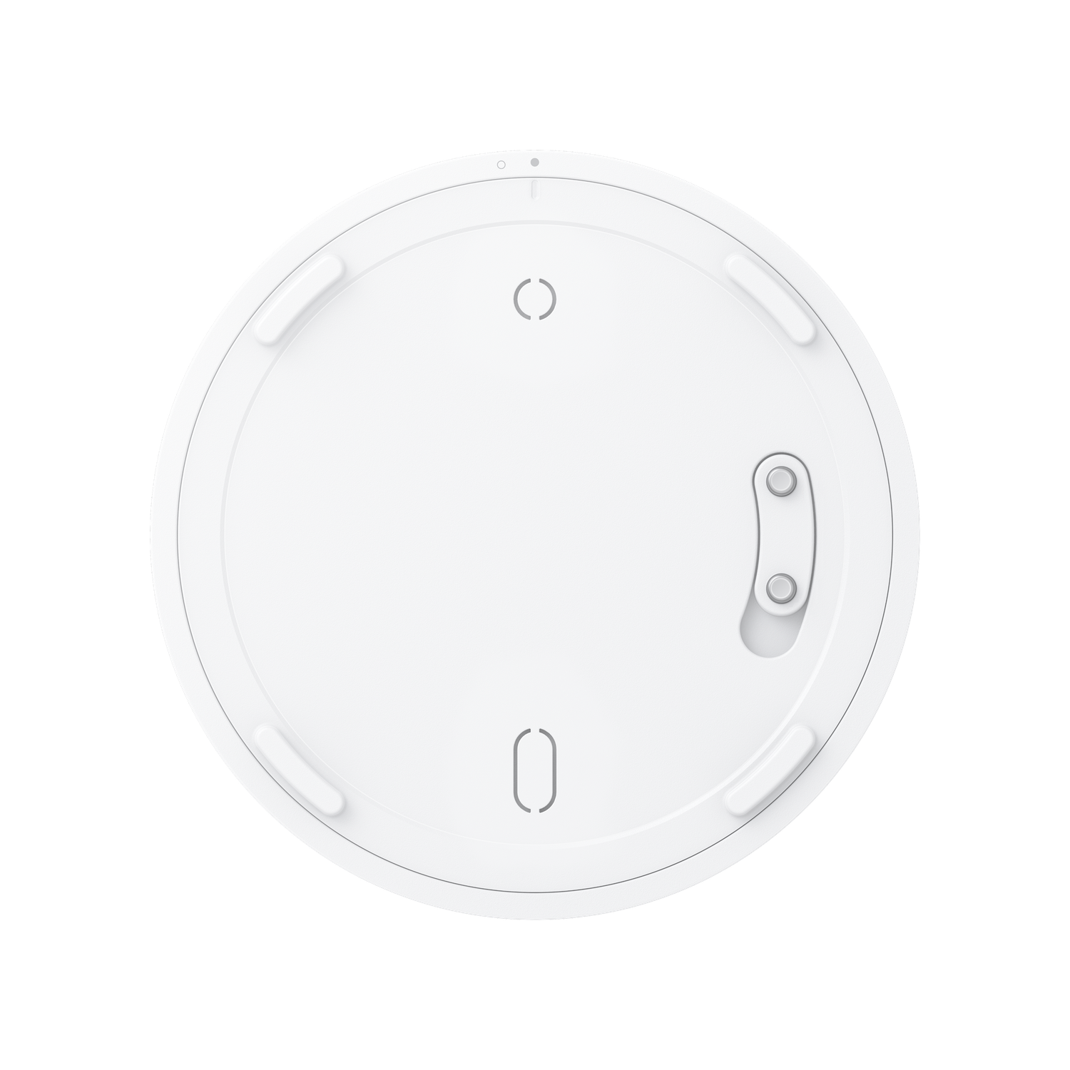 A white, circular device with a few small protrusions, a light, and a few indented shapes. The background is black.