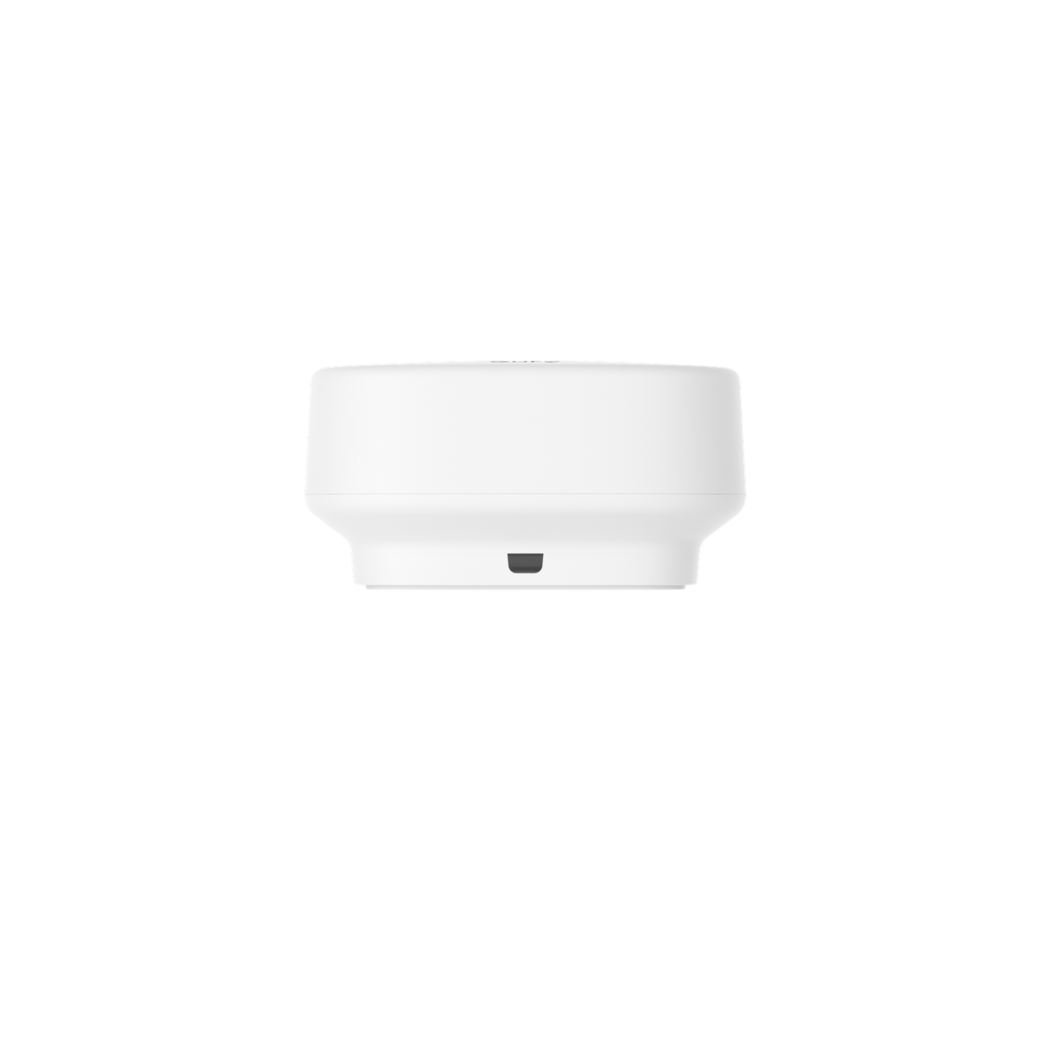 A white, cylindrical device with a flat top and a slightly flared base, set against a black background.