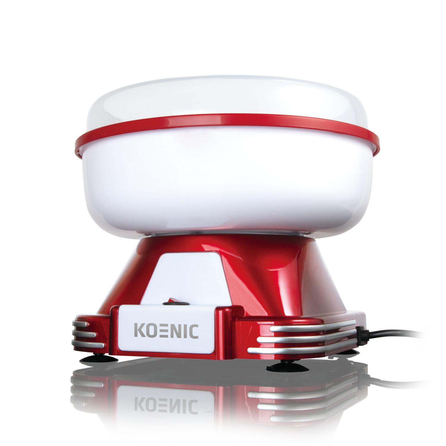A red and white Koenic cotton candy maker with a white top and a red base, sitting on a black surface.