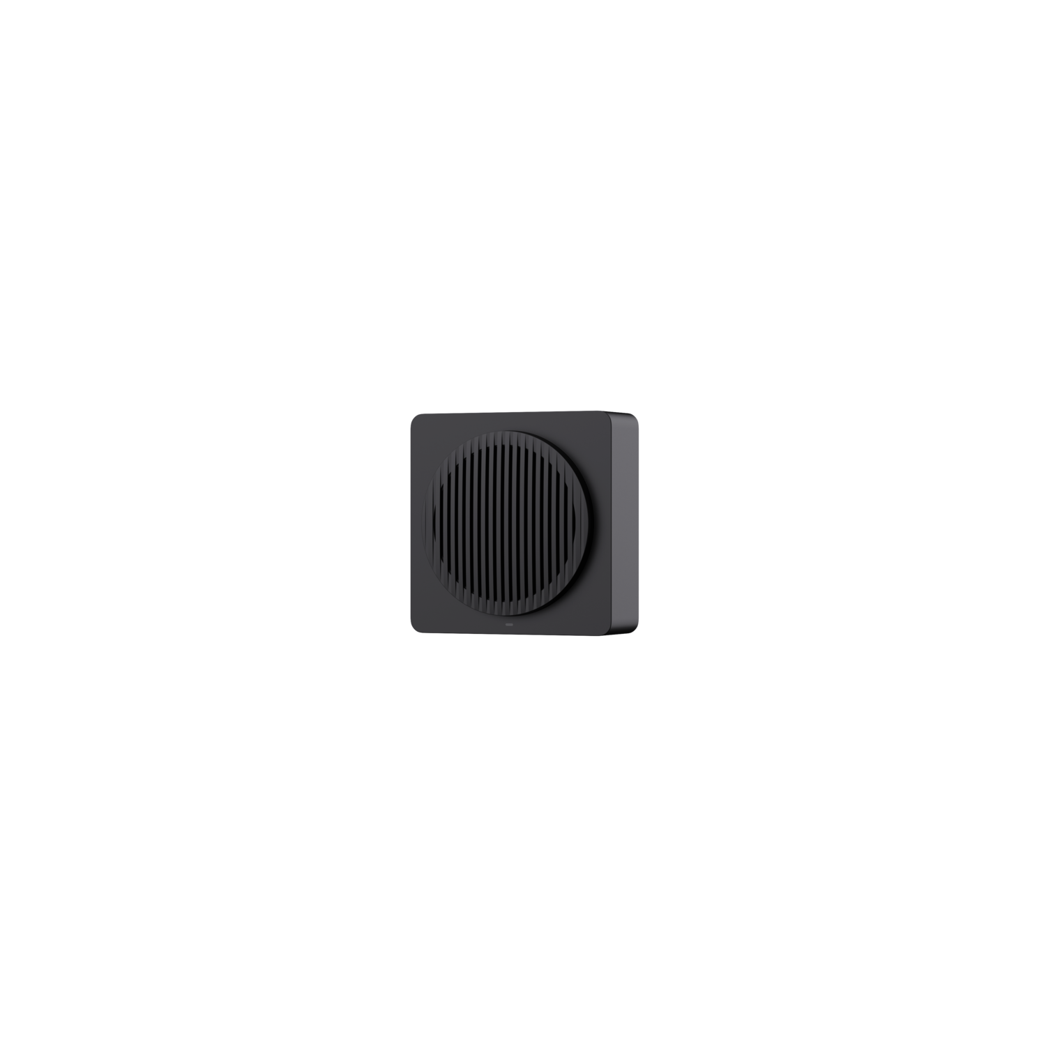 A top-down view of a black speaker with a circular, grated speaker cover. The background is entirely black.